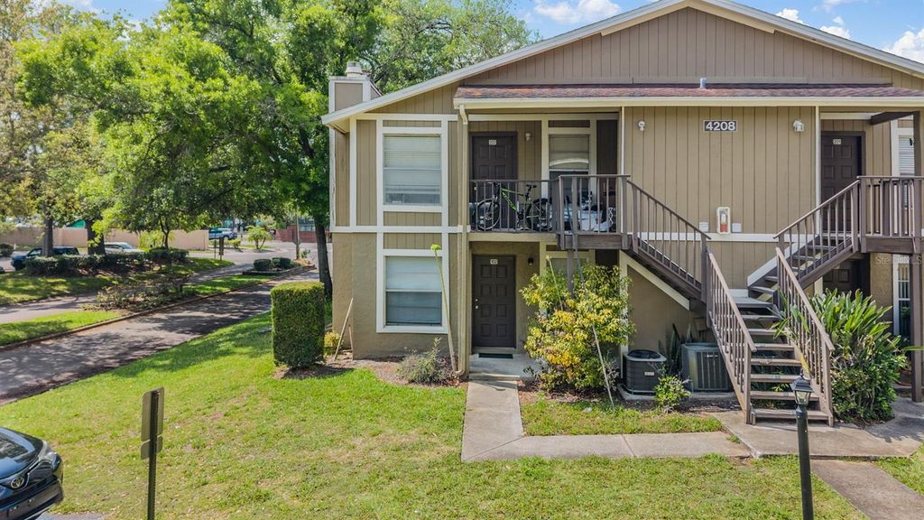 Photo of 4208 Winding Moss Trail #102, Tampa, FL 33613 (MLS # TB8489466)