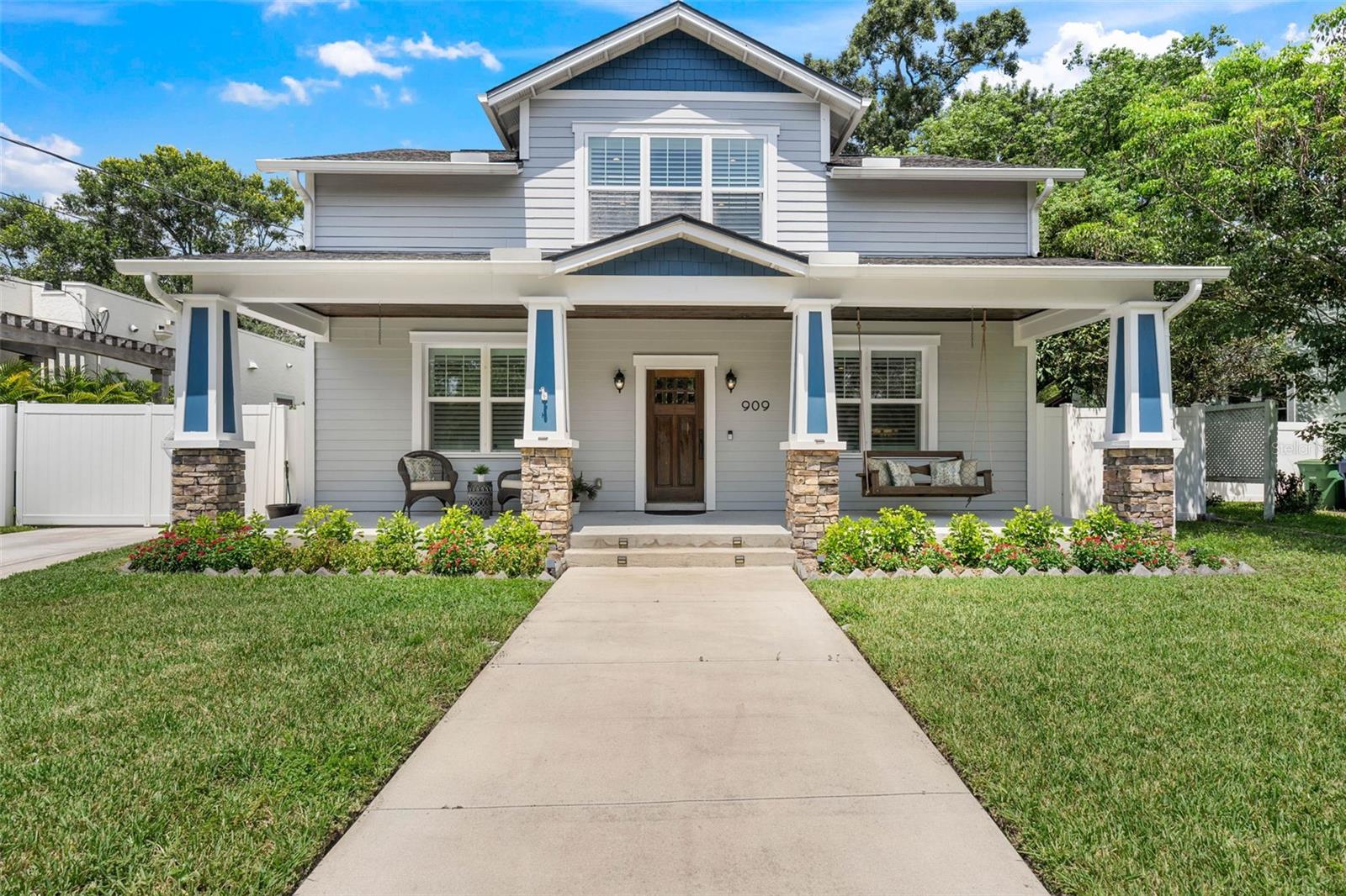 Experience luxury and craftsmanship in this unique custom home, crafted by a renowned boutique Tampa contractor. This residence seamlessly marries historic craftsman charm style with modern living.
At first glance, the home welcomes you with a picturesque covered porch. Upon entering, the warmth of wood flooring greets you, complemented by custom crown molding and meticulous millwork adorning every window and door. The open-concept layout allows natural sunlight to flood the living area, creating a bright and cozy space.
The kitchen boasts granite countertops, wood cabinets, and a spacious breakfast bar topped with luxurious leather-cut granite. Contemporary stainless steel appliances and a stunning tile backsplash enhance the farmhouse apron stainless steel single-basin sink. Recessed lighting, alongside over and under cabinet illumination, sets the perfect mood for any cooking adventure.
Adjacent to the kitchen, the expansive dining area is perfect for hosting gatherings, whether intimate or grand. French doors lead to a large covered lanai, the ideal spot to enjoy Florida's delightful weather. The backyard, secured by a vinyl fence, offers privacy and tranquility, while exterior lighting enhances the home's curb appeal day and night.
The main floor features a generously sized second bedroom with a full en suite bathroom, providing comfort and convenience. Upstairs, the third guest bedroom offers stunning backyard views, a cozy en suite bath, and a walk-in closet.
The primary bedroom suite is a private retreat, featuring large walk-in closets with custom storage solutions. Plantation shutters ensure privacy and light control, while the en suite bath delivers a spa-like experience with a clawfoot tub, a spacious walk-in shower, and dual vanities. A private water closet and a linen closet complete the luxurious amenities.
This home also includes a spacious laundry room conveniently located adjacent to the primary bedroom, an oversized two-car garage with overhead storage, and an automatic gate with remote control for secure parking of your car or boat.
Situated in an unparalleled location with proximity to local parks, the renowned Armature Works, and vibrant downtown Tampa, this home places you at the heart of the city's dynamic culture and amenities.
Discover the blend of modern comforts and timeless elegance in this meticulously crafted residence. Schedule your private showing today to experience the exquisite lifestyle this home has to offer.