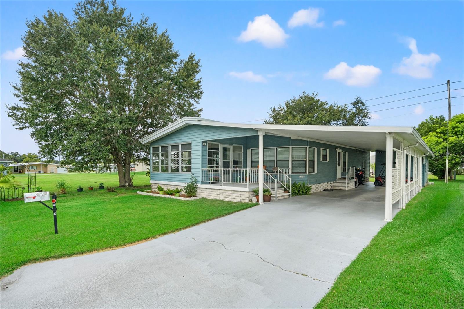 Charming 2-Bedroom 2-Bath Home in Active 55+ Golf Community of Betmar Acres – Land Owned! Welcome to this beautifully updated home tucked away on a quiet cul-de-sac in the heart of a vibrant 55+ golf community. With land ownership included and a low annual fee of just $435, you’ll enjoy affordable living in a neighborhood filled with activities, amenities, and friendly neighbors. Step inside to an open-concept layout featuring luxury vinyl plank flooring throughout. The kitchen has been tastefully updated with sleek counters and stainless-steel appliances, offering both style and function for everyday cooking or entertaining. At the front of the home, a cheerful sunroom has been seamlessly integrated into the central AC system, creating a comfortable four-seasons room where you can relax, read, or gather with friends year-round. The spacious owner’s retreat boasts a walk-in closet and a private en-suite bath with a step-in shower and updated vanity. The guest suite offers plenty of space for a queen-size bed and is conveniently located across from the updated second bath, which features a tub/shower combination. Practical updates give peace of mind: a durable metal roof, a brand-new AC system installed in 2023, and a new vapor barrier also added in 2023. This home blends comfort, style, and low-maintenance living in a welcoming golf community where you’ll enjoy the Florida lifestyle to the fullest. Betmar Acres is known for its top-tier amenities, including 27 holes of golf, two swimming pools, two hot tubs, three clubhouses, scenic walking trails, a library, and game rooms with billiards, table tennis, and board games. Other features include miniature golf, enclosed shuffleboard courts, tennis and pickleball courts, a basketball court, bocce courts, and weekly bingo—providing endless opportunities for fun and social connection. This exceptional home offers the ideal balance of comfort, style, and active living in one of Florida’s most vibrant 55+ communities. Schedule your private showing today and see everything Betmar Acres has for you to enjoy.