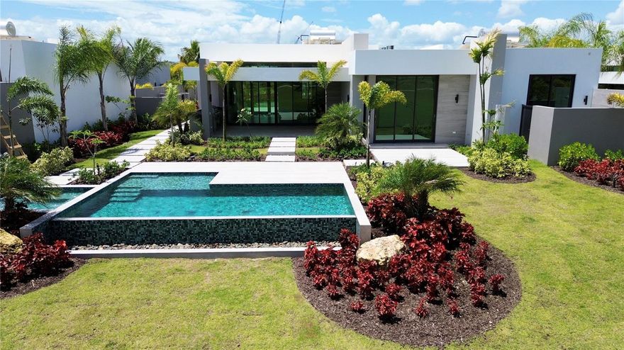 Single-level lakefront home at The Isles, Dorado Beach. With 5 bedrooms and 4.5 baths across 3,580 sq. ft., it offers unobstructed lagoon and golf course views. Set on a 993 sq. m. lot, it features a private infinity pool and outdoor kitchen—perfect for entertaining. Over $600K in upgrades, sold fully furnished in turnkey conditions. Plus, it comes with an outstanding lease generating $33,000/month in income.