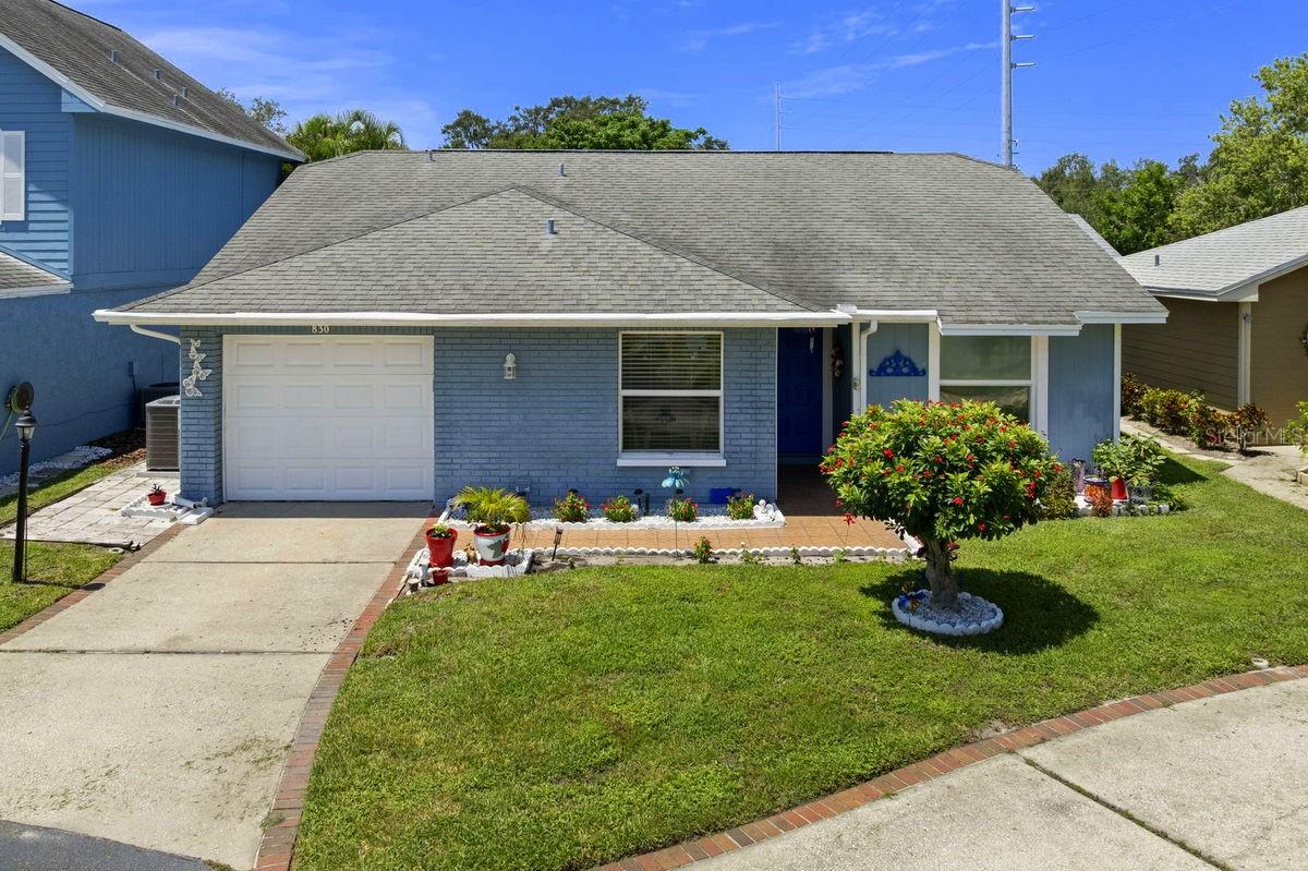 Looking for single family maintenance free living? Look no more! This 3BR/2BA block home is located in the sought after community of Franklin Square. It offers a captivating curb appeal and sits in a NON flood zone on a quiet cul-de-sac. The home features a bright, open, split bedroom plan with vaulted ceilings and an incredible 40' deck. It includes the following: covered front entry, front patio, welcoming foyer, open kitchen with breakfast nook & closet pantry, spacious living/dining room with glass sliders, master bedroom with private bath, guest or 2nd bedroom, office - den or 3rd bedroom, hall bath, oversized 1-car garage, PLUS a large relaxing rear deck and fenced back yard... PERFECT for your morning coffee and evening glass of wine. The abundant indoor and outdoor living spaces make this home great for entertaining. Updates include, KITCHEN: granite counters with backsplash, undermount stainless farm sink, faucet, stainless steel refrigerator & dishwasher, HALL BATH: vanity, faucet, mirror, and toilet, INTERIOR: light fixtures, pendant lights, ceiling fans, and engineered hardwood floors, EXTERIOR: 12x40 rear deck and tropical plants. Franklin Square is a meticulously maintained, pet friendly community with gated in-ground pool, paved sun deck, and restrooms. Maintenance fees include basic cable, internet, lawn care, water, sewer, trash, plus the community pool. It is ideally located near supermarkets, restaurants, shopping hubs, and major thoroughfares. A short drive away is the Dunedin Causeway, Honeymoon Island, Historic Downtown Dunedin, Quaint Colorful Ozona, the Sponge Docks of Tarpon Springs, and award winning Clearwater Beach. This convenient location allows you to enjoy countless activities such as beaches, parks, casual & fine dining, roof top bars, micro-breweries, cafes, boating, fishing, bike riding, festivals, concerts, art shows, spring training baseball, championship golf, and waterfront sunsets. This is a MUST SEE for buyers seeking an affordable single family home with an active & vibrant lifestyle.