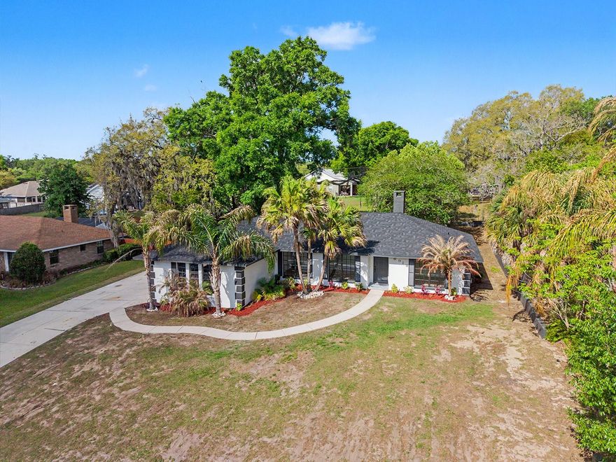 One or more photo(s) has been virtually staged. No CDD, low HOA (under $75/year), and a recently replaced roof make this beautifully remodeled 4-bedroom, 2-bath home a rare opportunity in Lakeland. Ideally located with convenient access to Polk Parkway and I-4, allowing for an easy commute to Tampa or Orlando, and just minutes from shopping, dining, and everyday conveniences.

This move-in ready home has been fully updated, featuring fresh interior and exterior paint and luxury vinyl flooring throughout. The modern kitchen offers quartz countertops, a stylish backsplash, included appliances, and is complemented by additional built-in cabinetry and a secondary sink just off the kitchen, providing a versatile space ideal for prep, storage, or potential laundry use.

The spacious primary suite includes an ensuite bathroom with tile finishes, dual vanity, and French doors leading directly to the screened-in pool area. The living room also features French doors that open to the outdoor space, creating a seamless indoor-outdoor flow ideal for entertaining.

Step outside to enjoy a private backyard with a screened-in pool surrounded by pavers, all set on a fully fenced 0.30-acre lot, larger than a quarter acre, offering added space and privacy.

Additional features include a wood-burning fireplace, updated lighting with spotlights, a guest bathroom with tub and tile, and a side-entry attached garage with an extended driveway, providing a more private and functional layout. The garage door and motor are new.

Don’t miss this opportunity, schedule your showing today!