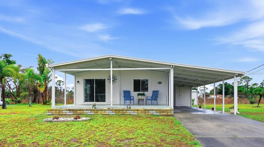 Boat Access + Fully Updated | No Mandatory HOA | Coastal Living in Englewood  Move right into this fully updated manufactured home in Englewood offering rare access to a voluntary HOA with marina and boat slips (subject to availability)—a standout opportunity for buyers seeking affordable coastal living near the water. Ideally positioned just minutes from the Intracoastal Waterway, Gulf beaches, Boca Grande, and Manasota Key, this property delivers both lifestyle and location.  Major improvements have already been completed, including a new TPO roof (2024), new A/C heat pump (2023), luxury vinyl plank flooring throughout (2024), and a fully renovated kitchen (2026) featuring plywood construction cabinets with soft-close doors and drawers, along with new stainless-steel appliances (2025–2026). Bathrooms have been refreshed with new vanities and toilets (2024). Exterior upgrades include fresh paint (2025), custom gutters and downspouts (2024), and a new carport, front overhang, and porch (2024). With no mandatory HOA, boating access, and close proximity to beaches, fishing, golf, and dining, this move-in ready Englewood home is ideal as a winter retreat, investment property, or full-time residence.