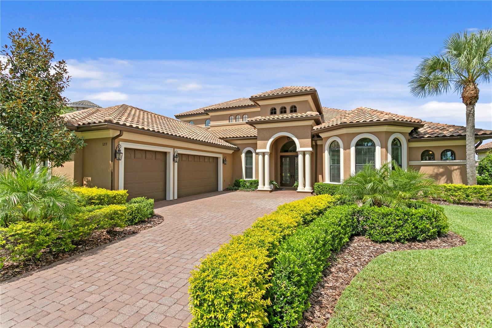 The charm of Ladera Estates - live expansively, privately, and beautifully. Known for it’s blend of tranquility and convenience, Ladera Estates offers a unique, gated lakefront community on Lake Merrywater. Welcome to 1213 Merry Water Drive with a timeless design, modern comfort, and breathtaking natural surroundings. Built in 2015 and situated on just under an acre with no rear neighbors, this custom-built residence offers 4882 sq ft of total living space. Set on .98 of an acre, this estate is designed for both grand entertaining and everyday luxury. Key Features: • GREAT ROOM – Enter through double doors into the Great Room with 12-ft ceilings, surround sound, and views of the pool, conservation and pond. A comfortable family room with sliding glass doors for seamless living to the outdoor terrace. • DESIGNER KITCHEN – An oversized granite island anchors the space, complemented by a hidden walk-in pantry with a coffee bar and dining room built in storage. Open concept living with an oversized casual dining room - ideal for gatherings large or small. • PRIMARY SUITE & MAIN LEVEL ROOMS – The main-level primary suite includes dual custom walk-in closets, and spa-inspired bath with freestanding tub and oversized walk-in shower. Three additional bedrooms, as oversized study, and drop-zone with built-ins next to a large laundry room complete the thoughtful main floor. • UPSTAIRS LIVING – Two oversized suites upstairs, each with private baths and large closets—perfect for guests, teens, or multigenerational living. The upstairs entertainment zone includes a large bonus room, wet bar with fridge, and balcony overlooking the serene pond and backyard conservation views. A separate movie room with 1/2 bath complete this entertainment space • RESORT-STYLE LIVING Heated pool with sunshelf, covered and fully screened terrace, full summer kitchen, and access to a pool bath. Lush, mature landscaping and lots of extra green space are a perfect space for play or pets• ADDITIONAL HIGHLIGHTS – Features 8-foot doors on both levels, 3-car garage, custom-finished walk-in closets, pantry and additional storage closet, crown and tray ceilings throughout. • This estate is more than a home- it’s a retreat. Wake up to sunrise views, unwind in complete privacy, and enjoy the serenity of expansive natural surroundings that draw you to Ladera Estates.• Located in Lutz- one of the Tampa Bay area’s most sought-after communities for its natural beauty, larger homesites, and tranquil lifestyle- you’ll enjoy the peace of country-style living with the convenience of being just minutes from top-rated schools, hospitals, dining, shopping, major highways, and Tampa International Airport. It’s the perfect balance of space, serenity, and accessibility.