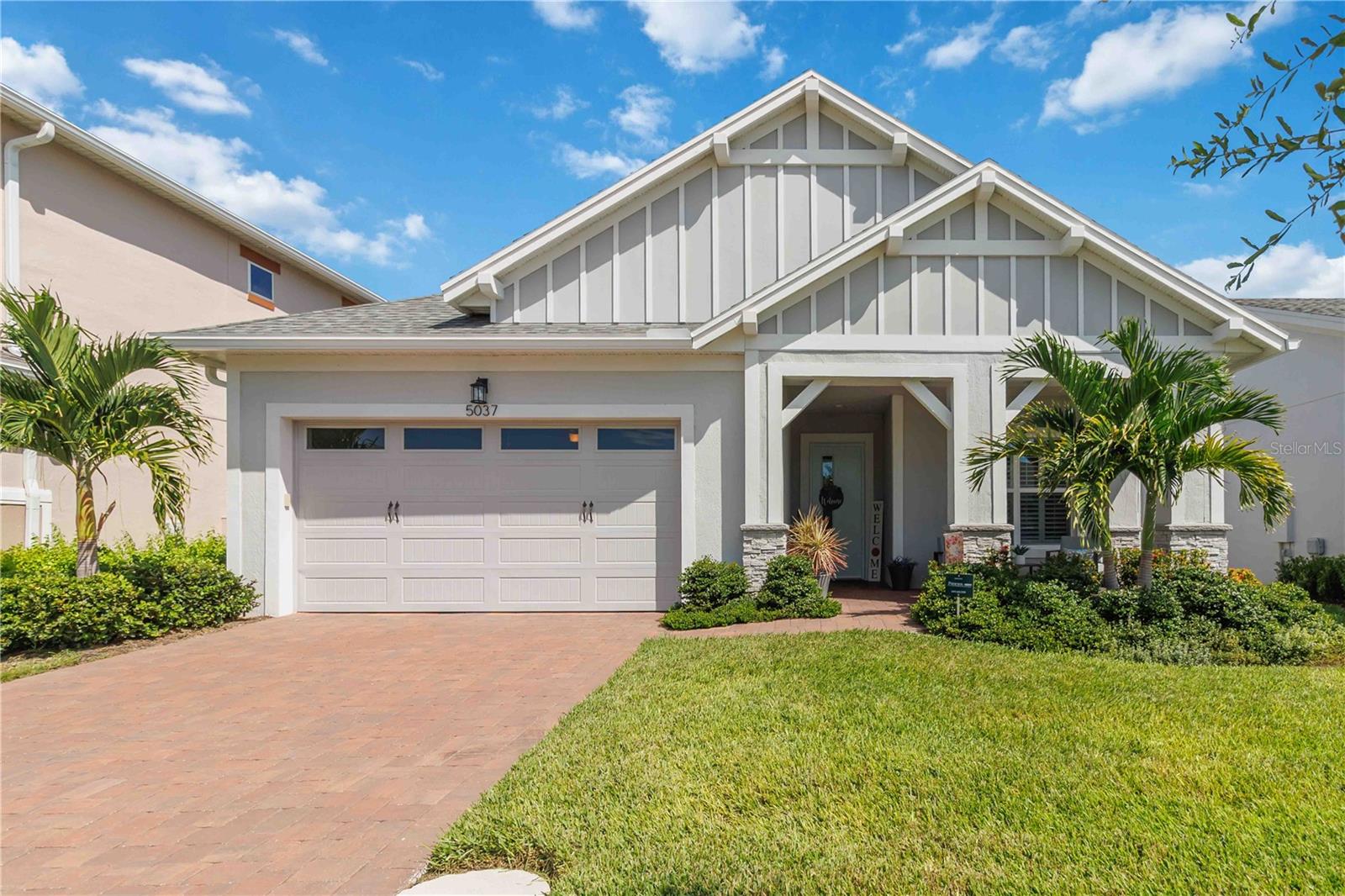 Welcome to Your Dream Home in Del Webb Twin Lakes!
This stunning 3 bedroom, 2.5 bath Cocoa floor plan with a den/office is located in the highly sought-after 55+ active lifestyle community of Del Webb Twin Lakes. From the custom tray ceiling in the foyer to the professionally painted interior with crown molding, plantation shutters, and gorgeous plank tile flooring, every detail shines.
The gourmet kitchen features upgraded light wood cabinets with crown molding, a custom marble-look backsplash, quartz counters with a show-stopping curved island, farm sink, gas cooktop, double ovens, custom hood, and glass pendant lighting. A huge walk-in pantry and upgraded laundry with cabinets and quartz counters add even more convenience.
The open living room flows to a screened lanai with electric blinds and a tranquil water view. The luxurious primary suite includes a tray ceiling, spa-like bath with frameless glass walk-in shower, dual shower heads, quartz dual vanity, and custom tile bench. The office is built-in with cabinets and a quartz desk. Even the garage has tiled floors!
Del Webb Twin Lakes offers resort-style amenities: 3 pools, a 20,000 sq. ft. clubhouse, fitness center, tennis, pickleball, putting green, fishing, boating, and endless social activities. All in a gated community just minutes from Lake Nona, Orlando Airport, theme parks, and beaches.
Don’t wait—schedule your private showing today!