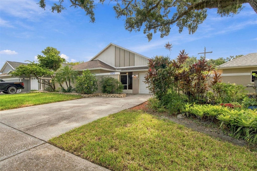 Photo of 11905 Hickorynut Drive, Tampa, FL 33625 (MLS # TB8550842)