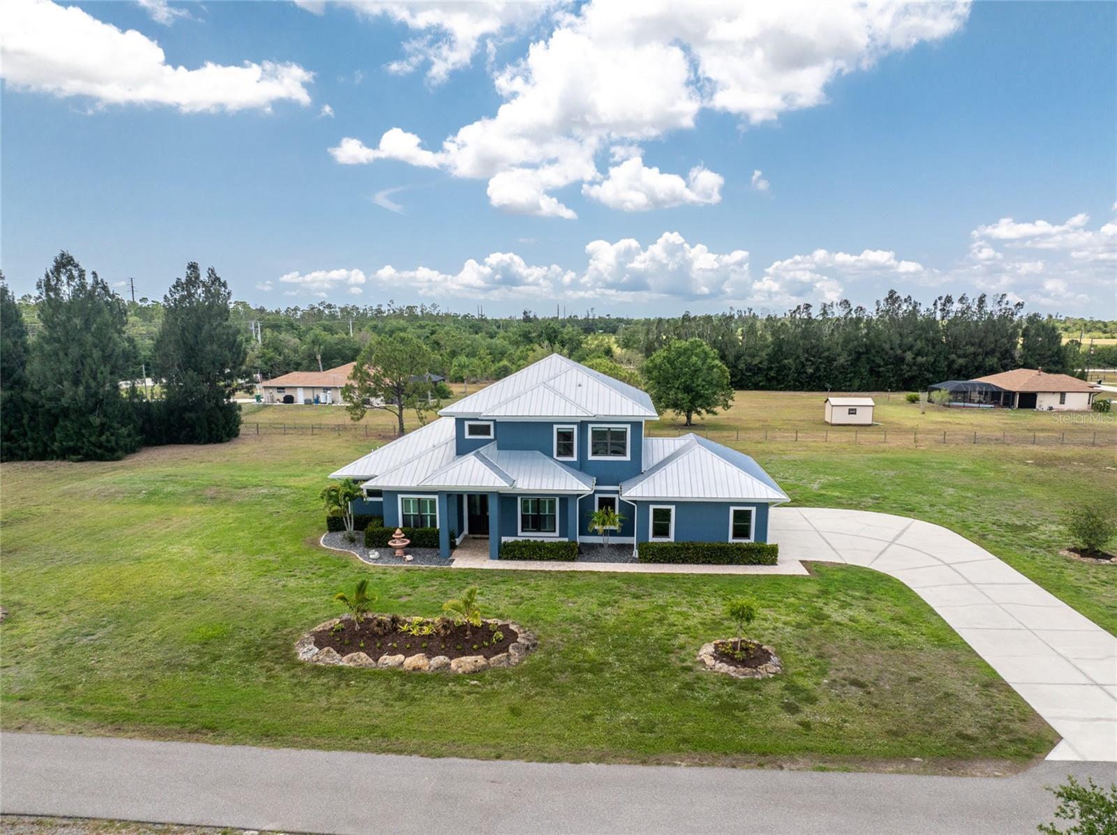 Horse and hobby Lover’s Dream on 7+ Acres with Massive RV/ workshop Garage & Equestrian Amenities
Live the Florida lifestyle with space, privacy, and every amenity you could ask for. This 3 bed, 2.5 bath home with office, den, and loft sits on 7+ fully fenced acres in a peaceful, non-deed-restricted area in Punta Gorda. Ideal for horse enthusiasts and hobbyists alike.
Equestrian Features:
Lighted round pen
Horse barn w/ concrete floor, 2 - 16x16 stalls, 8-ft overhang, finished tack room
Designated fenced horse pasture with pond
Privacy wooded landscaping, 2 gated/ fenced entry road access points
Garage/Workshop:
4,000 sq ft detached garage
2 RV bays (1 pull-through)
Car lift, A/C man cave with in, auto door, remote lighting
Wired security cameras
Outdoor Living:
Pebble Tec pool & spa
Pavers on front porch, back deck & pool area
Gas line to back porch for future outdoor kitchen
Stocked pond
Additional Highlights:
24kW Briggs & Stratton generator (2024) w/ 500-gallon buried propane tank
Hurricane protection, home audio throughout, security system
No HOA . Flood zone X
Minutes to I-75, 15 mins to downtown Punta Gorda, close to Punta Gorda airport
A rare opportunity to own a private land estate close to town with room for all your passions—horses, cars, RVs, and more!
Come live your best life in Paradise!