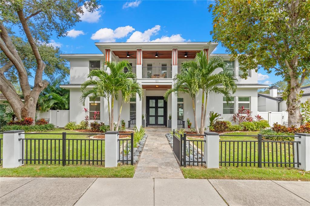 Welcome home to this 2018 West Indies-style influenced property located right in the heart of the Historic Old Northeast on a larger lot of 75 x 110! This solid-masonry constructed home features 4 bedrooms, an office, media room, 5.5 baths in the main home, and a detached 700 square foot guest house with a living room/kitchen, bedroom and bath above a three-car garage. Enjoy Florida living from the sprawling front porch or open the collapsible sliders from the living room that open to the pool. Enter through the custom steel double doors into a light and bright living space with high ceilings, a quaint sitting area, dining room and a kitchen with an island open to the living room with built-in cabinets and fireplace. The first floor boasts a master suite with dual closets, double doors leading to the pool deck and a stunning master bath with dual showers and sinks and a free-standing soaking tub. The gourmet kitchen highlights a 6 burner gas Wolf range with pot filler, stainless appliances, a large island with seating, a breakfast nook and walk-in wine storage. A second bedroom, ideal for a home office or guest bedroom with a full bath and laundry room round out the downstairs. The second floor offers two bedrooms with ensuite baths, a media room with balcony, another office/bonus room and a second laundry room. Entertain poolside in the cozy sitting area with TV or under the outdoor kitchen. Take in the Florida sunshine or sunset in the heated saltwater pool with waterfall, lush landscaping and privacy vinyl fencing. A rarity in the Old Northeast is a 3 car garage off the alley with a finished floor, built in storage cabinets and shelving. Schedule a private showing today to see this amazing property! Easy stroll or bike ride to the waterfront, downtown or 4th street restaurants and shops.