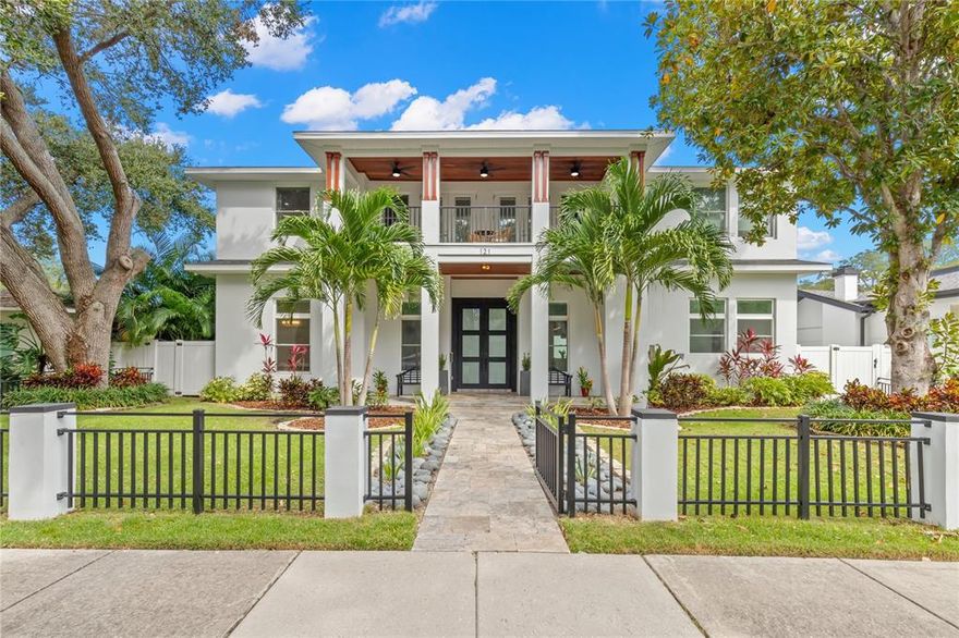 Welcome home to this 2018 West Indies-style influenced property located right in the heart of the Historic Old Northeast on a larger lot of 75 x 110! This solid-masonry constructed home features 4 bedrooms, an office, media room, 5.5 baths in the main home, and a detached 700 square foot guest house with a living room/kitchen, bedroom and bath above a three-car garage. Enjoy Florida living from the sprawling front porch or open the collapsible sliders from the living room that open to the pool. Enter through the custom steel double doors into a light and bright living space with high ceilings, a quaint sitting area, dining room and a kitchen with an island open to the living room with built-in cabinets and fireplace. The first floor boasts a master suite with dual closets, double doors leading to the pool deck and a stunning master bath with dual showers and sinks and a free-standing soaking tub. The gourmet kitchen highlights a 6 burner gas Wolf range with pot filler, stainless appliances, a large island with seating, a breakfast nook and walk-in wine storage. A second bedroom, ideal for a home office or guest bedroom with a full bath and laundry room round out the downstairs. The second floor offers two bedrooms with ensuite baths, a media room with balcony, another office/bonus room and a second laundry room. Entertain poolside in the cozy sitting area with TV or under the outdoor kitchen. Take in the Florida sunshine or sunset in the heated saltwater pool with waterfall, lush landscaping and privacy vinyl fencing. A rarity in the Old Northeast is a 3 car garage off the alley with a finished floor, built in storage cabinets and shelving. Schedule a private showing today to see this amazing property!  Easy stroll or bike ride to the waterfront, downtown or 4th street restaurants and shops.