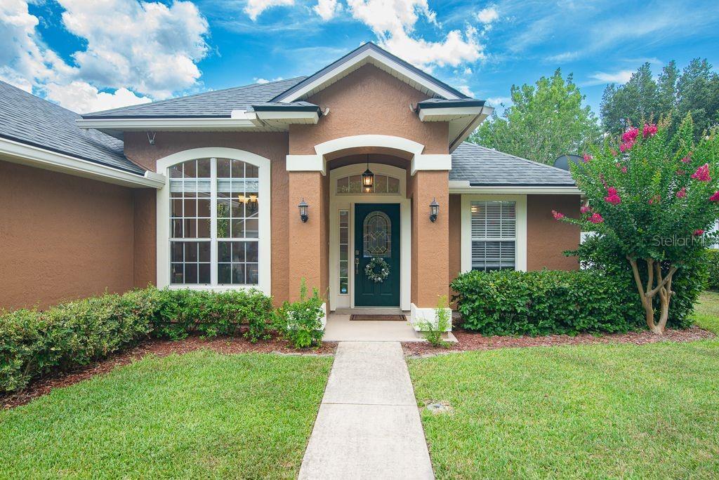 This move-in ready home in Julington Creek Plantation offers comfort, style, and modern updates throughout. Step inside to find wood-look tile flooring, brand-new carpet in the bedrooms, and a freshly painted interior and exterior siding. The kitchen features stainless steel appliances, and major systems have been updated with a 2022 HVAC, 2020 roof, 2016 water heater and 2023 LG Front Load Washer and Dryer.The layout includes an open-concept living area, a versatile separate dining or flex room, split-bedroom design for added privacy, an inside laundry room, and a fully fenced backyard ready for your personal touch. The side and backyard garden beds are already producing fresh herbs and vegetables, including rosemary, mint, parsley, and tomatoes—perfect for home chefs and garden enthusiasts alike.
As a resident of Julington Creek Plantation, you'll have access to an impressive suite of amenities, including a family-friendly pool, a competition lap pool, thrilling water slide, on-site cafe, fully equipped fitness center, clubhouse, tennis courts, golf course, neighborhood parks, and scenic walking paths. This home blends everyday comfort with resort-style living in one of the area's most sought-after communities, located near some of the best schools in the region. Soft Hot Tub does not convey.