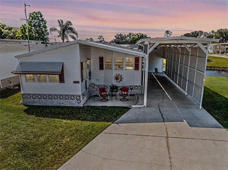 Welcome to your new haven! This beautifully maintained Waterfront RV Port Home in Phase 5 of Mount Olive Shores is ready to welcome you. Fully furnished and thoughtfully designed by Palm Harbor, this home features a warm and inviting Florida Room that flows into an expansive Living/Dining Room combination. The generously sized Primary Bedroom opens up to a stunning screened-in Lanai with picturesque water views, perfect for relaxation. You'll appreciate the versatile RV Port, accommodating motorhomes of all sizes, along with a handy workshop that includes overhead storage for your convenience.

The annual HOA fee covers essential lawn and common area maintenance, allowing you to enjoy your surroundings without the hassle. Mount Olive Shores is a vibrant, friendly, and safe gated community, ideally located just three and a half miles from I-4 and close to numerous shopping hubs, top-notch medical facilities, and both Tampa and Orlando International Airports. Plus, you’re only an hour away from Central Florida’s incredible attractions! This is a Class A Motorhome, Deed-Restricted community, and ownership of a Class A Motorhome is required for your first year of residency. Welcome to a wonderful lifestyle!