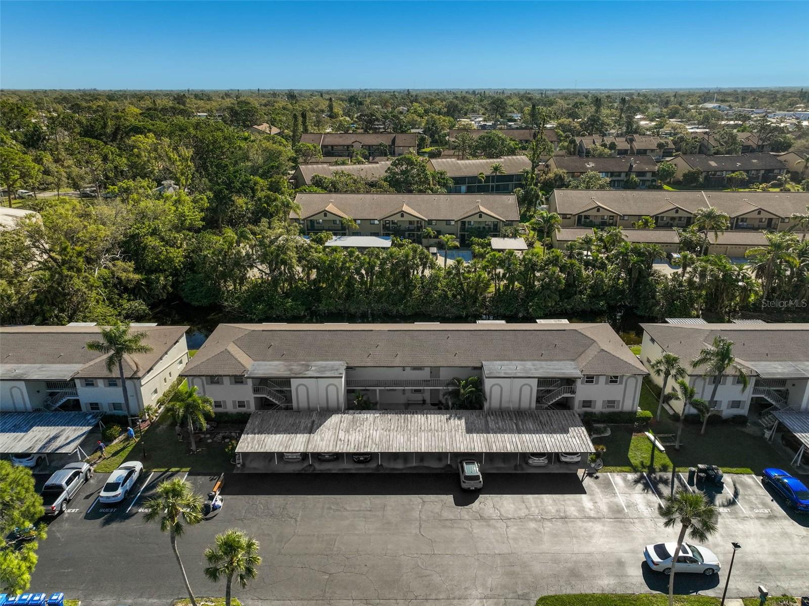 **LOCATION! LOCATION! Enjoy a Serene WATER VIEW from this TOP FLOOR, 2ND STORY Condo Unit** in popular Swifton Villas, an Adult Active Community. Featuring 1 BEDROOM and 1 FULL BATH, freshly painted interior, Luxury Vinyl Plank flooring in addition to the attractive parquet wood and tile floors, a nicely equipped kitchen with hardwood cabinets, etc. Enjoy the tranquil Water views from your elevated and covered Balcony. Includes exterior closet storage and laundry room plus a single, covered carport parking space. LOW Condo Fee. NEW ROOF (2024). SWIFTON VILLAS is an adult active community featuring a Clubhouse, Pool, shuffleboard, etc. and offers easy access to I-75, area Beaches including #1-rated Siesta Beach, Shopping, Downtown Sarasota and Venice cultural venues, and all that Florida’s Gulf Coast Living has to offer.