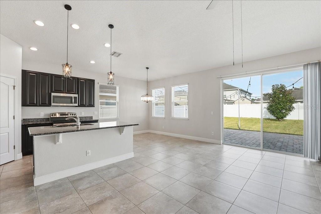 Photo of 11007 Inside Loop, Orlando, FL 32825 (MLS # O6368473)