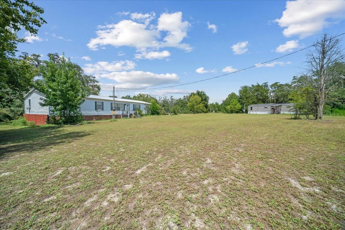 Endless potential awaits with this unique multi-family property situated on 3.36 acres of A1-zoned land. Featuring two mobile homes, this property is perfect for investors, renovators, or anyone looking to unlock serious value. Both homes need a little TLC, but with the right vision, they can be transformed into income-producing rentals, multi-generational living, or even a primary residence with space to grow. The A1 zoning opens the door to a variety of residential and agricultural uses—making this a truly flexible investment. With plenty of space, privacy, and potential, this is your chance to turn a diamond in the rough into something special. Opportunity awaits—bring your ideas and make it your own!