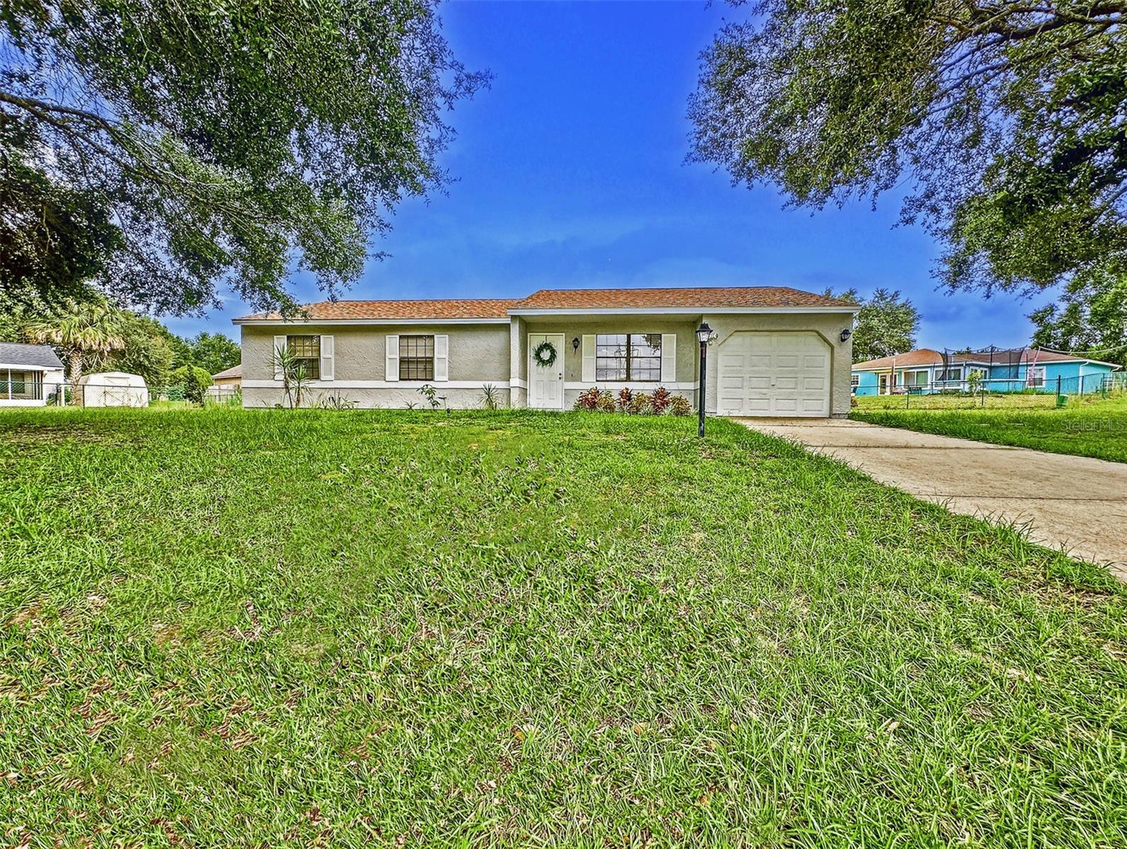 One or more photo(s) has been virtually staged. ***HONEY, STOP THE CAR – THIS IS IT! This spacious 3-bedroom, 2-bath home with a 1-car garage sits on one of the LARGEST HOMESITE in Lake Joy & Magic Lake Communities:0.37 acres tucked away on your OWN PRIVATE CUL-DE-SAC with VERY LOW HOA FEE*** This Home is the only one sitting in this large paved circle Cul-De-Sac, which means no through traffic and plenty of space to ride bikes, shoot hoops, host family gatherings, or even park your RV or boat, or any other toy.
Inside, you’ll love the open floor plan with vaulted ceilings, over 1,325 sq ft of living space, and updates that make this home truly move-in ready nd worry free: NEWER ROOF (2019) • NEWER AC (2019) • BRAND-NEW WATER HEATER (2025) • NEWER LUXURY VINYL PLANK FLOORING throughout the living areas and bedrooms • NEW 12x12 GAZEBO, covering the back porch—perfect for relaxing after a long day
The Primary Bedroom is a true retreat—oversized with elegant French doors, dual his-and-hers closets, and plenty of room to unwind. Throughout the home, you’ll also find numerous closets and storage options
This neighborhood offers so much more than a house—its a lifestyle! Lake Joy & Magic Lake has scenic trails, parks, and lakes to explore. Plus, for just $5 per year per household member (over 10 years old) you can join and have access to the Silver Springs Shores Community Center, featuring RESORT-SYLE & LAP POOLS • PICKLEBALL & BASKETBALL courts • BEACH COLLEYBALL & FITNESS CENTER • BILLIARDS ROOM • BOAT RENTALS, PAVILLION & COMMUNITY EVENTS
All this while being just minutes from major highways for easy commutes and close to Florida's famous natural springs for kayaking, swimming, and weekend adventures.
This Ocala gem is the perfect starter home with room to grow. Don’t wait, schedule your showing today and make it yours!