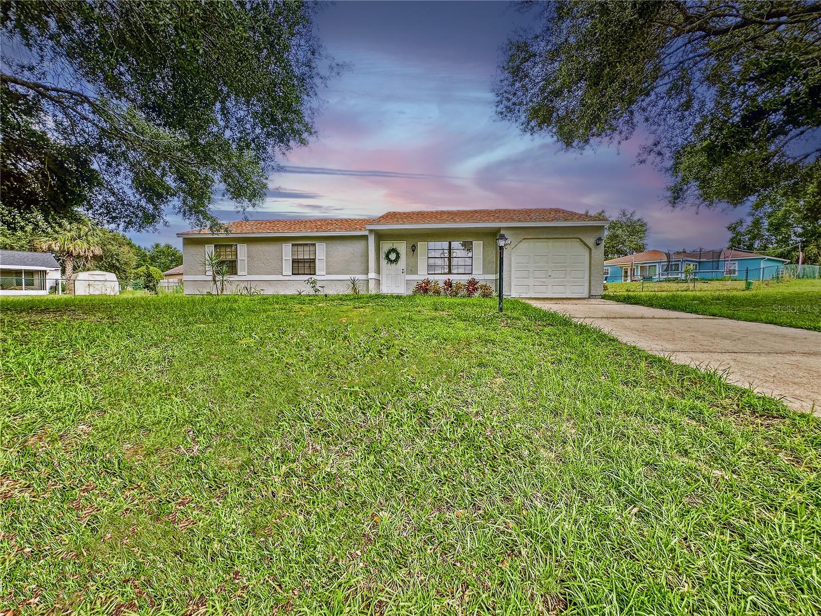 One or more photo(s) has been virtually staged. :-) THIS HOME QUALIFIES FOR 100% FHA FINANCING OR CONVENTIONAL 1% DOWN WITH OUR PREFERRED LENDER* :-) ***HONEY, STOP THE CAR – THIS IS IT! This spacious 3-bedroom, 2-bath home with a 1-car garage sits on one of the LARGEST HOMESITE in Lake Joy & Magic Lake Communities: 0.37 acres tucked away on your OWN PRIVATE CUL-DE-SAC with VERY LOW HOA FEE*** This Home is the only one sitting in this large paved circle Cul-De-Sac, which means no through traffic and plenty of space to ride bikes, shoot hoops, host family gatherings, or even park your RV or boat, or any other toy.
Inside, you’ll love the open floor plan with vaulted ceilings, over 1,325 sq ft of living space, and updates that make this home truly move-in ready nd worry free: NEWER ROOF (2019) • NEWER AC (2019) • BRAND-NEW WATER HEATER (2025) • NEWER LUXURY VINYL PLANK FLOORING throughout the living areas and bedrooms • NEW 12x12 GAZEBO, covering the back patio—perfect for relaxing after a long day.
The Primary Bedroom is a true retreat—oversized with elegant French doors, dual his-and-hers closets, and plenty of room to unwind. Throughout the home, you’ll also find numerous closets and storage options.
This neighborhood offers so much more than a house—its a lifestyle! Lake Joy & Magic Lake has scenic trails, parks, and lakes to explore. Plus, for just $5 per year per household member (over 10 years old) you can join and have access to the Silver Springs Shores Community Center, featuring RESORT-SYLE & LAP POOLS • PICKLEBALL & BASKETBALL courts • BEACH VOLLEYBALL & FITNESS CENTER • BILLIARDS ROOM • BOAT RENTALS, PAVILLION & COMMUNITY EVENTS.
All this while being just minutes from major highways for easy commutes and close to Florida's famous natural springs for kayaking, swimming, and weekend adventures.
This Ocala gem is the perfect starter home with room to grow. Don’t wait, schedule your showing today and make it yours! Don't hesitate to ask about our 100% FHA Financing or the Conventional 1% Down!
*NO INCOME LIMIT FOR THE 100% FHA PROGRAM - INCOME LIMIT 80% AMI for the Conventional 1% Down.