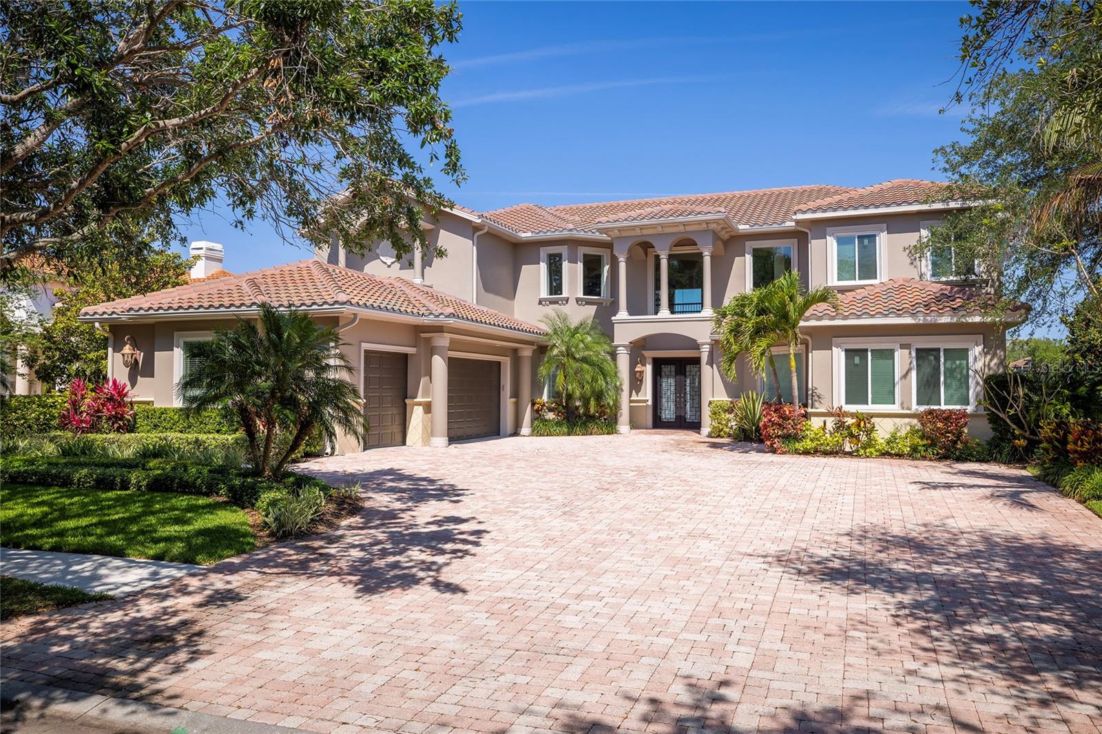 NO FLOOD INSURANCE is required for this property. Some impact rated windows. New tile roof August 2022. Discover this architectural masterpiece nestled within the 24-hour guard-gated Highlands of Innisbrook community. Embrace the Florida resort lifestyle with community gated access to the renowned Innisbrook Golf Resort, home of the PGA Valspar Tournament. Resort amenities include three golf courses, tennis courts, pickle ball courts, fitness center, full service spa, five heated pools, and restaurants. Built in 2007, this home combines timeless elegance with modern elements. New air conditioners installed in 2018, 2019, and 2025. Exterior painted April 2025, and the interior of the first floor was freshly painted in March 2024, ensuring a move-in ready experience. Upon entering the grand foyer, you’ll be captivated by the dramatic 22' ceilings, intricate ceiling designs, and eye-catching chandeliers. The foyer opens up to the two-story formal living and dining rooms, perfect for entertaining guests. A spacious office, strategically tucked away from the shared living areas, provides privacy and tranquility. The island kitchen features Cherry wood cabinets, granite countertops, and a bar that can accommodate up to six bar stools. Top-of-the-line stainless steel appliances, including a 2023 Sub-Zero refrigerator, a Viking 6-burner/griddle gas range with hood, two 2022 dishwashers, an under-counter microwave, and a large walk-in pantry, ensure a seamless culinary experience. A Butler’s Pantry with two beverage refrigerators conveniently connects the dining room and kitchen. The kitchen seamlessly flows into the breakfast room and family room, where a gas fireplace adds warmth and comfort during cooler months. The first-floor owner’s suite is a true retreat, featuring a gas two-sided fireplace, a sitting area, and an elegant bath with a jetted tub, a travertine walk-in shower, two private water closets, and dual vanities. A full bath is accessible from the main living areas and pool for convenience. Two stairways lead to the second floor, where you’ll find four spacious bedrooms—two with private baths and two sharing a Jack and Jill bath. Guest bedrooms sized for possible in-law suite. A second floor laundry chute leads to the first-floor laundry room. The theater room, equipped with a newer sound system and a wet bar, is perfect for watching movies, sports, or gaming. The second-floor balcony offers a serene space to relax and enjoy golf course views. The Sedona-inspired spillover spa & salt-chlorinated pool, an outdoor kitchen with a new gas grill and refrigerator, and a child safety fence offer outdoor enjoyment. The oversized three-car side-load garage includes a Tesla charging station and two large storage closets. Located approximately 7 miles from Honeymoon Island State Park beach and the Caladesi Island Beach ferry, and just across the street from the community is access to the 54-mile Pinellas Trail and Wall Springs Park with playgrounds. Clearwater Beach, a world-renowned vacation destination, is under 13 miles away, and Tampa International Airport is under 22 miles away. Enjoy easy access to the Gulf beaches and the vibrant city of Tampa. This home offers the perfect blend of luxury, convenience, and resort-style living.