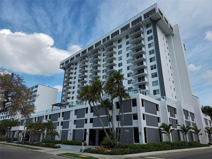 One or more photo(s) has been virtually staged. LIVE IN THE HEART OF THE ARTS ON PALM AVE AND GULFSTREAM downtown Sarasota, across from world famous Bayfront Park, marina and waterfront dining. This upgraded unit has impact windows and sliders, upgraded electrical and plumbing, an updated kitchen, and an open plan layout with tile floors and in-unit stack washer/dryer.  Build your outdoor urban garden on your rare large patio deck with room for dining and lounging! This rare corner unit places you in the center of everything. Stroll to Sarasota Bay, Bayfront Park, a marina or O,Learys tiki bar, Marina Jack’s restaurants, theaters, art galleries, fine dining, the farmers market, and Whole Foods—all just steps away. Awesome Amenities & Views on the amenities level, this city-view residence offers the urbanite breathtaking Sarasota Bay sunsets from your doorstep. Enjoy direct access to the heated pool, club room, BBQ area, and state-of-the-art fitness/yoga rooms.  The 101 Condominium is a prime downtown spot with extensive structural upgrades and major exterior renovation and has successfully passed its Milestone inspections, assuring an extended economic lifespan. Take advantage of this opportunity while it lasts.