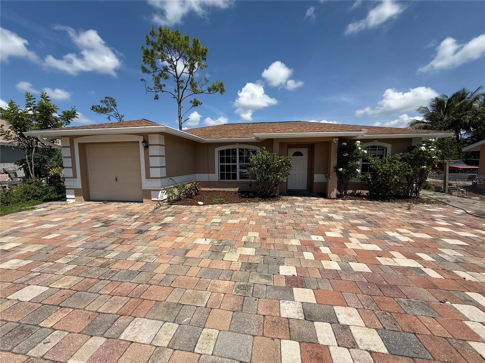 Stunning Fully Remodeled 3 Bedroom, 2 Bathroom Home! Welcome to your beautifully renovated retreat! This spacious 3-bedroom, 2-bathroom home has been completely updated inside and is ready for you to move right in. Step inside to discover brand new luxury vinyl plank (LVP) flooring throughout — no carpet anywhere — creating a sleek, modern look that's easy to maintain. The freshly painted interior feels bright and inviting, perfect for both relaxing and entertaining. Enjoy cooking in the stunning new kitchen featuring brand new cabinets, elegant quartz countertops, and stainless steel appliances. Both bathrooms have been tastefully updated with modern finishes, giving the home a fresh, contemporary feel. Outside, you'll find a generous backyard with a covered area, ideal for outdoor dining, gatherings, or simply enjoying Florida's beautiful weather. The home also offers a 1-car garage plus plenty of additional parking for guests or extra vehicles. Don’t miss this opportunity to live in a fully updated home with stylish upgrades throughout!