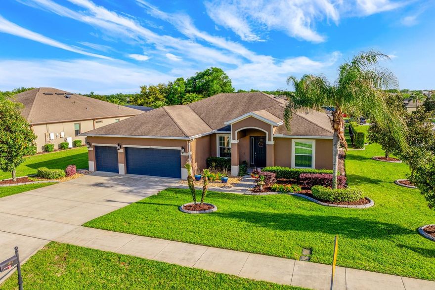 Seller may consider buyer concessions if made in an offer ~ Freshly updated and MOVE-IN READY, this single-story 5-bedroom POOL HOME sits on a spacious .43 ACRE ~ CORNER LOT in the sought-after Rock Springs Ridge community of Apopka – offering the space, privacy, and outdoor lifestyle you have been searching for! **IN 2026** FRESH INTERIOR PAINT in the primary suite, living areas, and front bedroom **IN 2025** Decorative ACCENT WALL added in the primary bedroom, upgraded faucets in the primary bath **IN 2021** TILE FLOORING added to the primary bedroom and closets ** IN 2020** CROWN MOLDING added throughout the main living areas and primary bedroom, CUSTOM KITCHEN BACKSPLASH, and decorative accent walls in the living room and guest bedroom. From the moment you arrive, the 3-CAR GARAGE, mature landscaping, and oversized corner lot set the tone. Inside, the home feels light, open, and welcoming with a flowing layout designed for both everyday living and entertaining. The kitchen is centrally located with UPDATED STAINLESS STEEL APPLIANCES (all recently replaced except the stove), a custom backsplash, and easy connection to the main living and dining spaces. The PRIMARY SUITE is tucked away at the back of the home for privacy and features updated finishes, tile flooring, a decorative accent wall, and a spacious en-suite bath. With five true bedrooms, there is flexibility for guests, a home office, or multi-generational living. Step outside and the Florida lifestyle really shines – your BACKYARD RETREAT is FULLY FENCED and designed to enjoy year-round. Relax by the POOL, entertain at the TIKI BAR (included!), or gather around the custom FIRE PIT on a concrete slab. Concrete curbing and thoughtful landscaping complete the tropical feel, creating a space that truly feels like your own private escape. Additional highlights include a TESLA EV CAR CHARGING STATION and laundry room cabinetry for added storage. Rock Springs Ridge is known for its quiet, established feel, GOLF COURSE access, TRAILS, and proximity to everything Apopka has to offer. Zoned for top-rated schools – including the new KELLY PARK K-8 nearby – and just minutes to SR 429, shopping, dining, the Northwest Recreation Complex, Wekiwa Springs State Park, and Lake Apopka. A rare combination of space, updates, and outdoor living all on one level – this one checks all the boxes. Call today to schedule your tour!