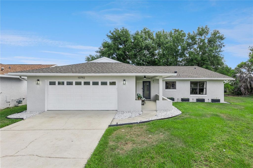 Photo of 10792 Lazy Lake Drive, Orlando, FL 32821 (MLS # O6409534)