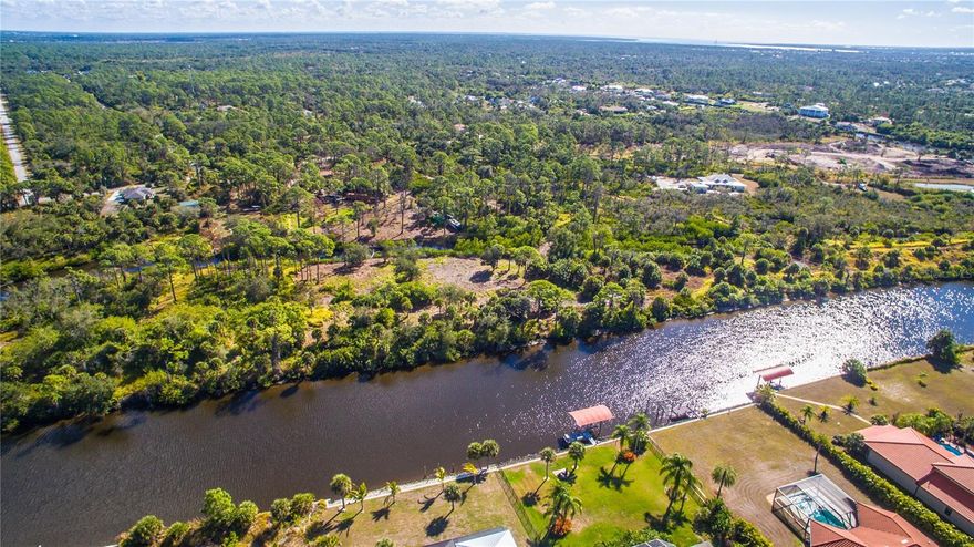 OUTRAGEOUS WATERFRONT 1.56 ACRES ON APOLLO WATERWAY WITH DIRECT ACCESS TO MYAKKA RIVER IN NORTHWEST PORT CHARLOTTE!!!  120 FEET OF WATER FRONTAGE WITH AN ISLAND CONNECTED BY A LAND BRIDGE.  SEVERAL CUSTOM HOMES ALONG THE CANAL. THIS IS YOUR OPPORTUNITY TO BUILD A PICTURESQUE WATERFRONT ESTATE IN A SECLUDED AND TRANQUIL SETTING, JUST MINUTES FROM SHOPPING, TWISTED FORK ENTERTAINMENT COMPLEX, RAYS AND BRAVES SPRING TRAINING,  AND JUST 20 MINUTES TO THE WORLD CLASS PRISTINE MANASOTA BEACH. IN JUST MINUTES DOWN THE  APOLLO WATERWAY YOU WILL INTERSECT WITH OLD FLORIDA ON THE  MYAKKA RIVER  FOR SOLITUDE, NATURE WITH AMENTITIES. YOU FOUND IT! A DAY OF BOATING WILL INCLUDE CHARLOTTE HARBOR, THE INTERCOASTAL WATERWAY AND THE GULF OF MEXICO. GET LOST FISHING AND BOATING AROUND BOCA GRANDE, LITTLE GASPARILLA AND CAPITIVA. LOOKING FOR A RARE OPPORTUNITY? BUILD NOW OR WAIT. PLENTY OF ROOM FOR YOUR RV, BOATS, AND BEST OF ALL NO HOA, CDD OR DEED RESTRICTIONS TO IMPEDE YOUR DREAM!! OWNER FINANCING AVAILABLE WITH 30% OWN