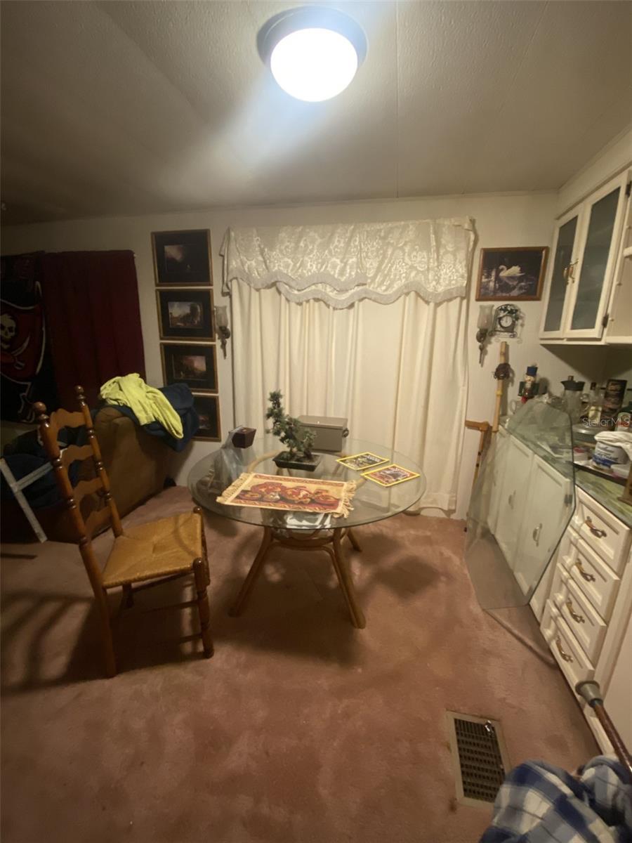 TARPON SHORES MOBILE HOME VILLAGE UNIT 186 . Enjoy affordable, MAINTENANCE-FREE LIVING WITH A LOW MONTHLY CO-OP FEE OF $315, covering lawn mowing, lawn spraying (fertilizer, insecticide, and weed control), water, sewer, trash pickup, cable TV with a park information channel, internet and Wi-Fi. No additional fees, no special assessments, and low taxes—all in a non-flood hazard zone. Nearby golfing, the Pinellas Trail, boating, shopping, fine dining, and breathtaking sunsets just minutes away. This is your chance to own a home in one of Tarpon Springs best 55+ communities. Check out the virtual tour. Don’t miss your opportunity to own this gem—schedule your showing today!