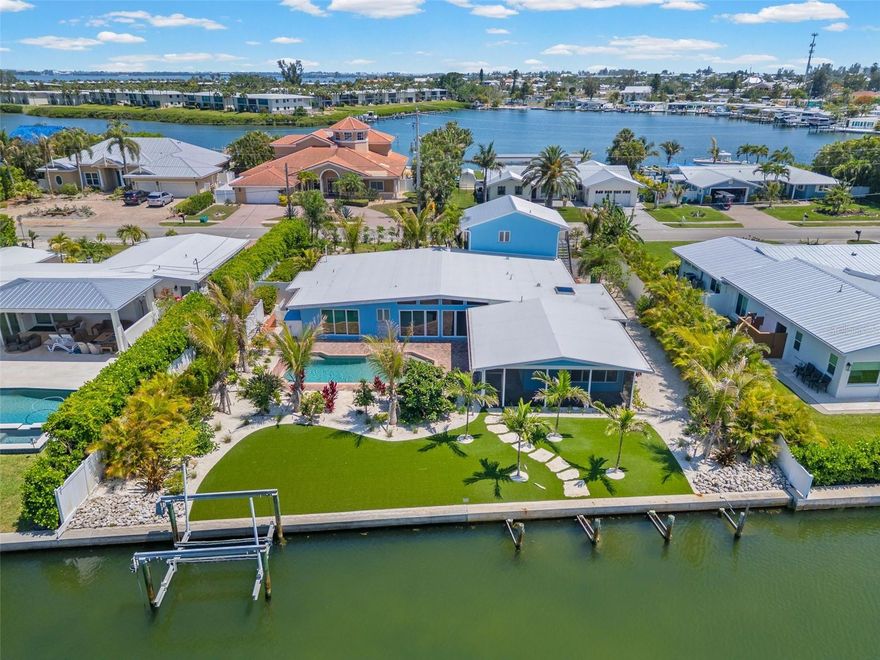 One or more photo(s) has been virtually staged. Welcome to this extensively renovated waterfront residence in the highly desirable Key Royale community. This 4-bedroom, 4-bath home pairs elevated coastal living with modern improvements and direct boating access to the Gulf.
Renovated from top to bottom, including a redesigned chef’s kitchen features high-end finishes and opens to spacious living and entertaining areas, while each bathroom has been updated with clean, contemporary detail. The property includes a new roof, four new A/C units, updated landscaping, a new garage door, and new garage flooring.
For added flexibility, the private fourth bedroom above the garage has its own entrance—ideal for guests, multigenerational living, a home office, or a bonus flex space.
Designed for entertaining, the home offers a new wet bar and effortless indoor-outdoor flow. Outside, enjoy private canal frontage with a boat lift and direct Gulf access—perfect for boating and island living.
Move-in ready and beautifully appointed, this home delivers luxury, versatility, and a true waterfront lifestyle just minutes from renowned beaches, dining, and shopping. Discover modern elegance and relaxed coastal charm in one of Anna Maria Island’s premier boating communities.