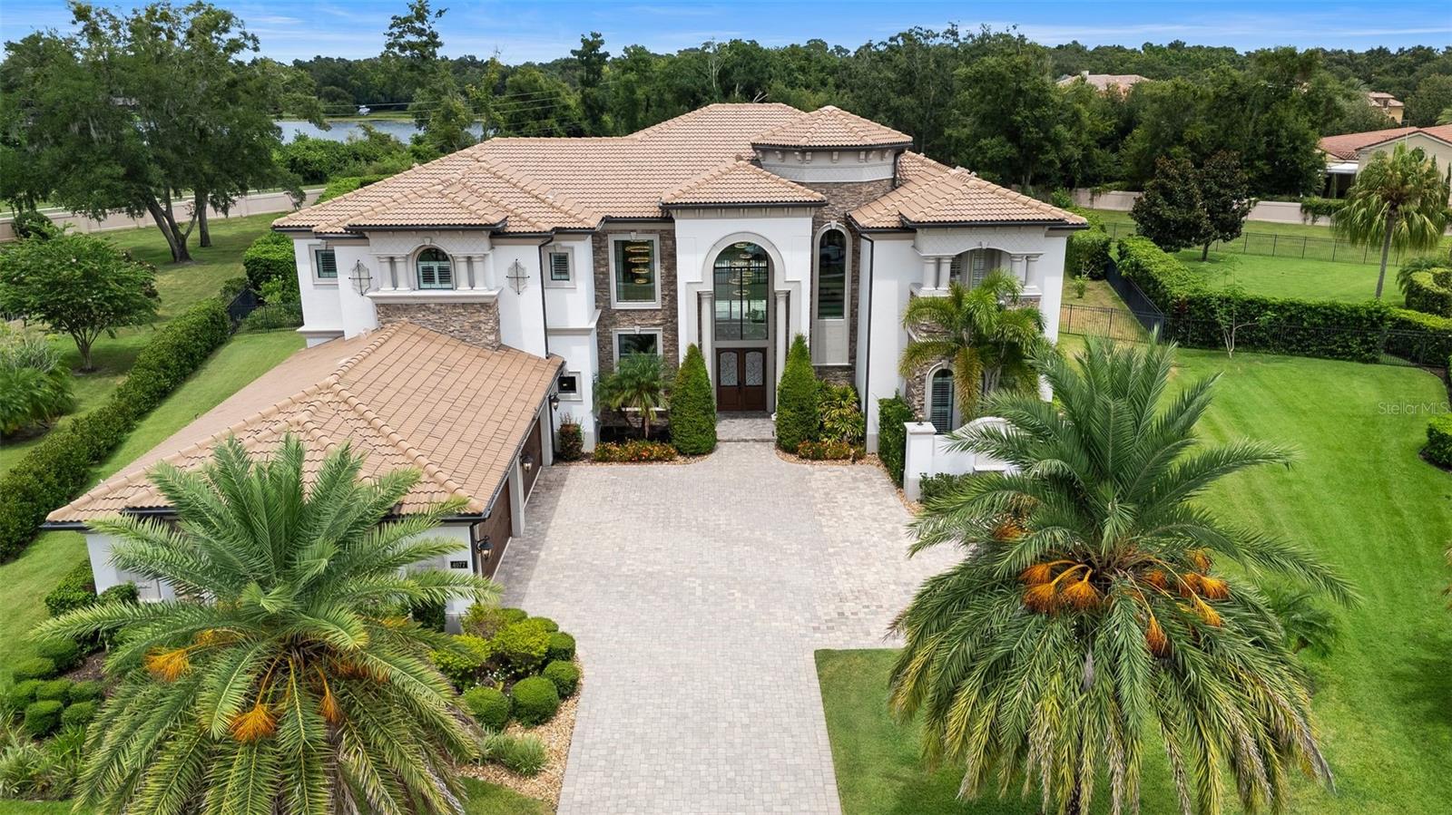 One or more photo(s) has been virtually staged. Stunning contemporary estate on over 1 acre in guard-gated Casabella. This 6-bedroom, 6 full bath, 2 half bath custom home offers over 7,500 sq ft of luxurious living. Open-concept design with soaring ceilings, walls of glass, and high-end finishes throughout. Gourmet kitchen with extended islands, premium appliances, and seamless flow into the great room and formal dining. First-floor primary suite with spa-like bath and custom closets. Each secondary bedroom includes an en-suite bath. Additional highlights include a home office, media room, and theatre room. Expansive backyard with resort style pool and outdoor kitchen. Smart home features, 4-car garage, and prime location near top-rated schools, golf, and amenities.