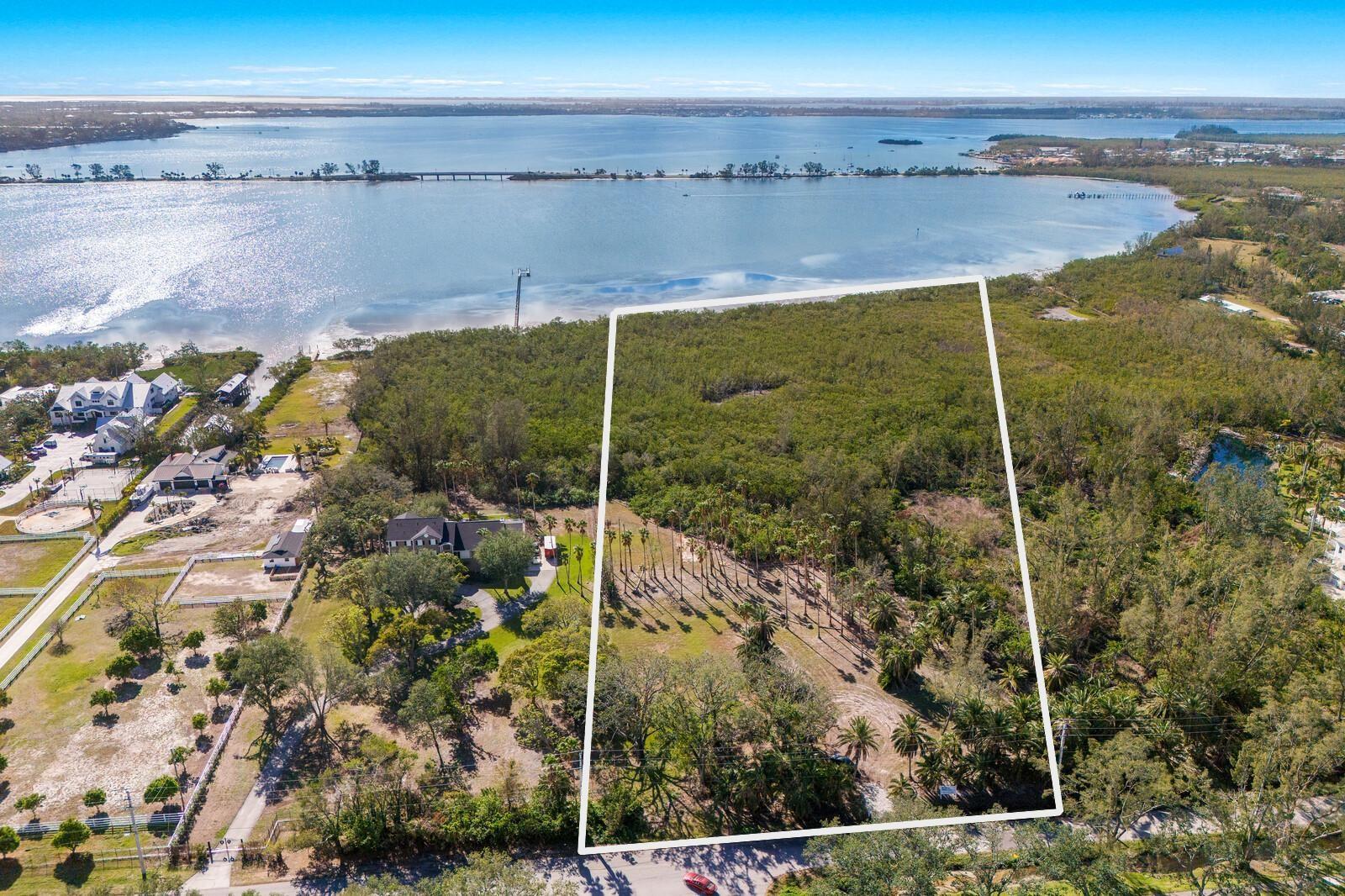 ***PALMA SOLA BAY WATERFRONT ESTATE LOT ON OVER 5 ACRES*** Discover one of the last remaining waterfront lots on Palma Sola Bay, a stunning property with 197 feet of DIRECT BAY FRONTAGE! Nestled in the highly sought after Northwest Bradenton area, this exceptional lot is surrounded by the Robinson Preserve, generational family farms, and elegant estate homes. Offering unparalleled privacy and tranquility, this unique property is perfectly suited for an expansive estate home, a sprawling family compound, or even a picturesque hobby farm. Mature hybrid Reclinata palms line the property, creating a lush tropical sanctuary that is the envy of botanical enthusiasts. Access is via a charming private entrance on 9th Ave NW, framed by majestic 100-year-old Grand Oaks. The natural beauty continues with native tropical foliage and refreshing breezes, offering the ideal backdrop for designing your dream dock on one of Florida’s most protected bays. From this safe and serene location, enjoy quick boating access to the Intracoastal Waterway and the Gulf of Mexico. Despite its secluded feel, this property is just minutes from local conveniences, including shopping, medical facilities, top-rated public and private schools, and the renowned IMG Academy. Plus, you’ll have easy access to the pristine white sandy beaches of Anna Maria Island and world-class fishing in the Gulf. If you’ve been searching for the perfect place to build your dream home and embrace the ultimate Florida lifestyle, your search ends here. Don’t miss this once-in-a-lifetime opportunity to own a piece of paradise on Palma Sola Bay!