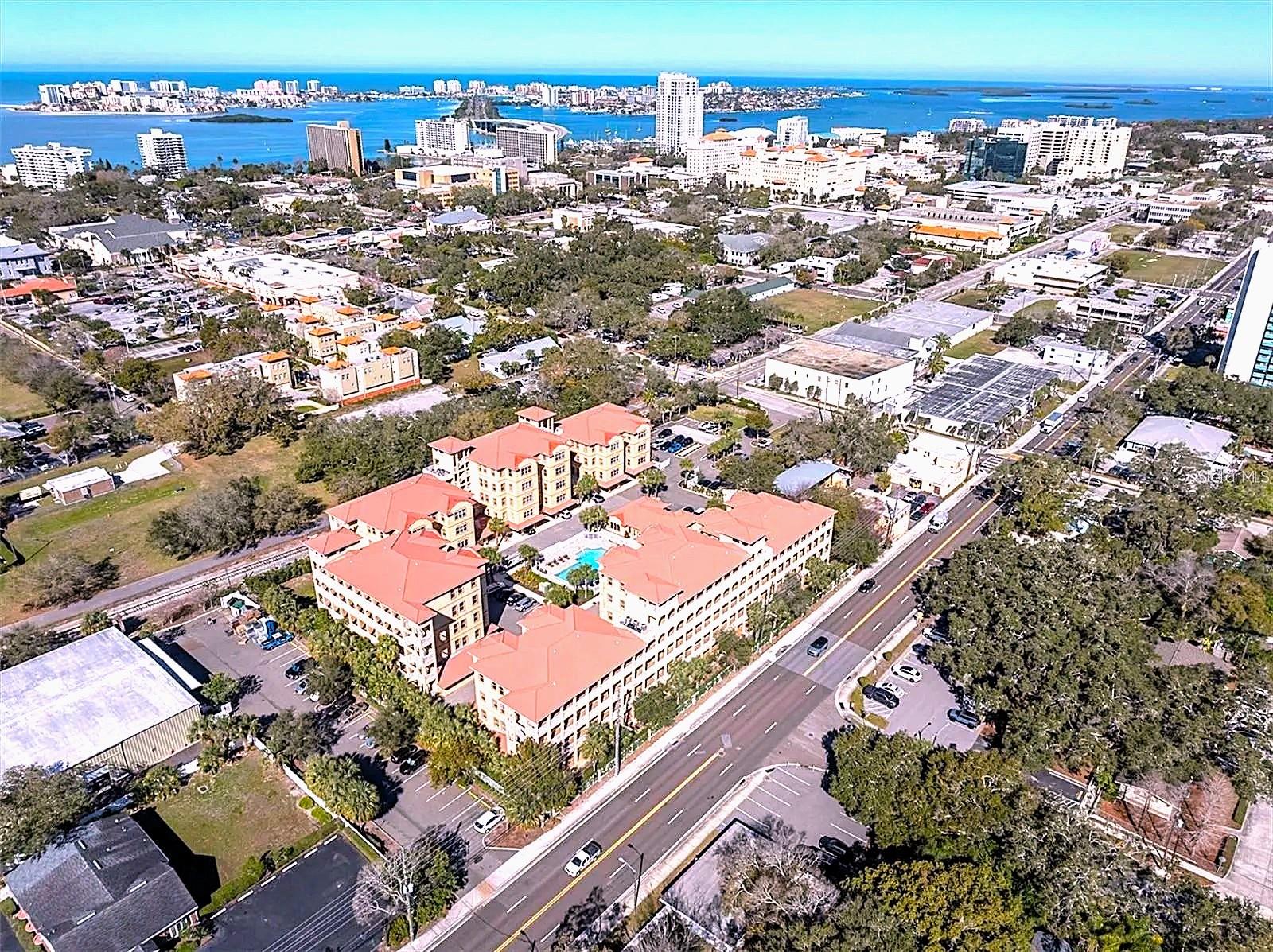 Welcome to Unit 402 at Old Clearwater City Flats, a beautifully updated Mediterranean-style condo in a gated community just minutes from vibrant Downtown Clearwater and all it has to offer—charming shops, delicious dining, cultural attractions, and community events—and only a short drive to the world-renowned Clearwater Beach. This spacious 2-bedroom, 2-bathroom residence offers 1,588 square feet of refined living space, including a bright Florida room/den perfect as a third bedroom or home office. The open-concept layout features soaring 9'4" ceilings, rich tile flooring throughout, and newer laminate flooring in the secondary bedroom, Florida room, and great room. Custom wood paneling accents add character and charm—highlighted in the sunroom, on the wall of the secondary bedroom, and as a stylish accent wall in the main living area. The kitchen is a chef’s dream, equipped with granite countertops, wood cabinetry, and appliances less than two years old. The spacious primary suite offers a walk-in closet and dual vanities, while the secondary suite ensures comfort and privacy. Recent upgrades include a newer A/C system (less than 2 years old) with UV light, a water heater under 1 year old, and new ceiling fans throughout the unit. A rare two-car tandem garage and in-unit laundry make everyday living effortless. Residents enjoy resort-style amenities including a heated pool, fitness center, clubhouse, and beautifully landscaped grounds. With its move-in ready condition, premium finishes, and unbeatable location close to both downtown and the beach, this condo offers the ultimate combination of style, comfort, and convenience.