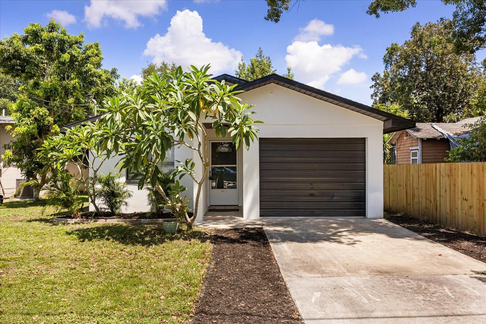 One or more photo(s) has been virtually staged. Welcome to this beautifully renovated 3-bedroom, 2-bathroom home offering modern style and peace of mind with upgrades inside and out. Step into a bright, open interior featuring a brand-new kitchen with stainless steel appliances, soft-close cabinetry, and elegant fixtures. Both bathrooms have been completely remodeled, complemented by new vinyl flooring, baseboards, fresh paint, updated light fixtures, and upgraded closet shelving. The spacious primary suite includes a walk-in closet and private access to the backyard. Thoughtful details like new door hardware and reinforced subflooring elevate the home throughout. Major improvements include a new electrical panel, new HVAC system inside and out, a 2020 roof, and a termite bond for added security. Outside, the home showcases fresh stucco, professional landscaping with new sod, a fully fenced backyard with a deck, a repurposed patio for entertaining, and a new fence on the right side for privacy. Ideally located just steps from Fort Gatlin Park, less than 10 minutes to Downtown Orlando, and close to SoDo’s shops and dining, this home blends the feel of new construction with the convenience of a prime Orlando location.