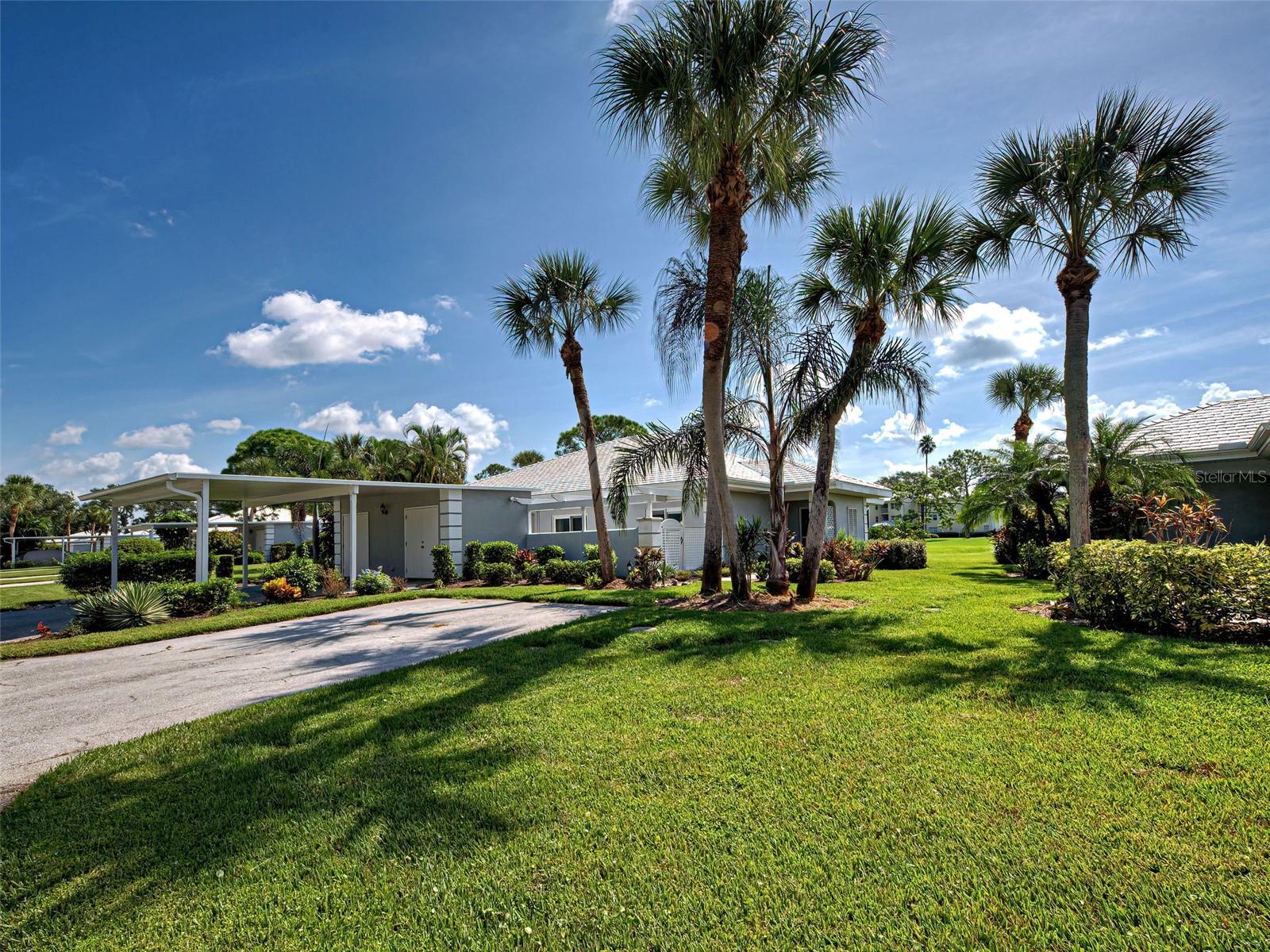 This two bedroom, two bathroom condo has been completely remodeled from top to bottom with meticulous attention to detail! Being sold fully furnished, this condo is truly move-in ready! Located directly on the golf course, with a tee view of the 7th hole on The Plantation Bobcat Course. The entire interior renovation was completed in 2024 with the addition of NEW hurricane windows, sliders and doors. Along with a New Roof, and New Water Heater, the carport was also reinforced and rebuilt that year. The lanai was redesigned and completed in 2025, adding an upper extension. Exterior storage doors were also replaced.
This villa style condo has a covered carport for parking. The interior is brand new, not a single project to complete! Spacious living and dining room area with new coordinating furniture. The kitchen is like a dream with an open concept, new appliances, unique marble countertops, coordinating tile backsplash and tons of natural lighting! LPV waterproof flooring runs throughout the entire home completing the modernization. Design is intentional and cohesive throughout the condo, from colors and furnishings, to the coordinating tile and matching countertops.
The split floor plan makes each bedroom feel like its own en-suite. The guest bedroom has a slider leading out to the back lanai with views of the golf course. They also have access to the full guest bathroom with tub/shower combo.The main bedroom's vanity area ceilings were raised to bedroom level heights, opening up the room and adding to the storage capability. This bathroom has a large walk-in shower to enjoy! The main bedroom has a slider leading outside to a large private patio, beyond the patio is the storage room (former laundry area). The laundry has been moved inside the condo, next to the guest bathroom, no need to go across the patio anymore! The extra room, also accessible from the carport; has space for bikes, other storage, and includes a workbench and sink.
Located in the community of Augusta Villas at the Plantation, directly across from the community pool with ample off street guest parking. The HOA fee for this community includes cable tv, lawn care, community pool, maintenance of the exterior, sewer, water, trash and pest control. Membership at The Plantation Golf and Country Club is optional and would be an additional fee. The Plantation Golf and Country Club has various membership levels; basic Dining, a Sports & Fitness Membership, or Full Golf Membership. Additional amenities with membership include a Fitness Center, Pool (heated and chilled), Pickleball, Tennis Courts, Bocce Ball Courts, and Clubhouse