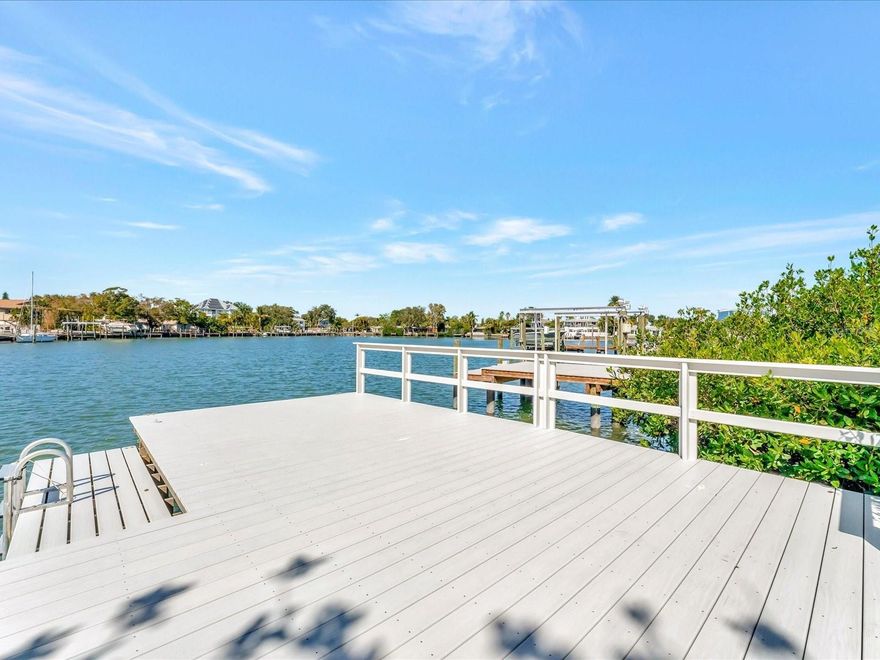 Almost 1/3 of an acre on the Intracoastal! This charming waterfront property features 4 bedrooms, 3 baths and is located near the end of a cul-de-sac street. Nestled along 40 feet of serene waterfront, this property invites you to transform it into your waterfront haven. With ample potential for renovation or new construction, this property provides a unique opportunity to shape a living space that reflects your vision and personal style. Already enhanced with a range of notable updates, including recent PGT impact windows, a composite dock installed in 2021, and an A/C system added in 2021, this home prioritizes your comfort and modern convenience. Yet, the appeal of this property doesn't stop there. The owner has generously supplied comprehensive building plans and architectural blueprints for renovating or new construction. Enjoy launching your kayaks or paddle boards and go fishing from the newer composite dock! This golf-cart friendly community offers a myriad of amenities to support an active lifestyle. Located a few blocks to miles of sandy beaches along the Gulf of Mexico and Kolb Park featuring tennis/pickleball courts, a basketball court, skate park, playground and softball/baseball field home to West Pinellas Little League. Also close to many fabulous restaurants and shops and a short 30-45 minute drive to International Tampa Airport, St. Pete and Tampa. This residence places your dream lifestyle within easy reach. Whether you seek a tranquil escape or an active beachside retreat, this home offers limitless potential to create the perfect sanctuary. Make this waterfront property your own and turn your dreams into a reality!