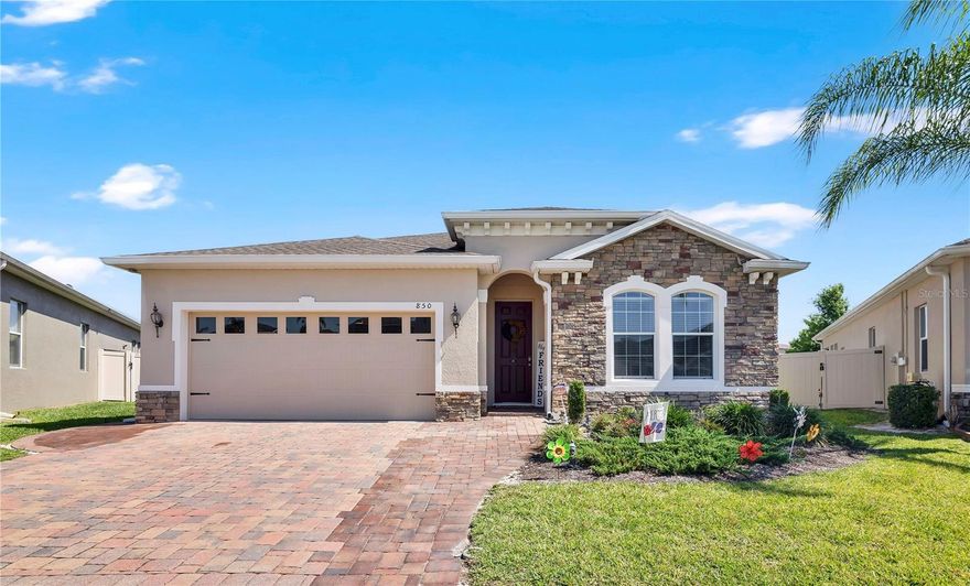 Welcome to 850 Bucklebury Loop, a beautifully upgraded 4-bedroom, 2-bath home located in the highly sought-after Forest Lake Estates community. Situated on a desirable corner lot with an extended yard, this thoughtfully designed home combines modern upgrades, functional living space, and an exceptional location.

Inside, the open-concept layout is enhanced by upgraded tile flooring throughout the main living areas, creating a seamless flow that is both stylish and easy to maintain. The kitchen serves as the centerpiece of the home, featuring granite countertops, stainless steel appliances, ample cabinetry, and a spacious oversized island that provides the perfect balance of prep space, storage, and seating for entertaining or everyday living. The kitchen also includes a brand new refrigerator and garbage disposal installed in 2026.

The private primary suite offers a comfortable retreat with a walk-in closet and ensuite bath, while the additional bedrooms provide flexibility for guests, a home office, or growing households.

The exterior of the home has recently been painted and sealed, adding to its curb appeal and long-term maintenance. The extended brick driveway, entryway, and rear patio add functionality and outdoor living space, ideal for enjoying Florida living year-round. Additional features include keyless entry, a Ring camera system, and a crime prevention/security system that convey with the home.

Residents of Forest Lake Estates enjoy resort-style amenities including a community pool, clubhouse, playground, walking sidewalks, and private loop access to the West Orange Trail. Conveniently located near Forest Lake Golf & Country Club with easy access to SR-414, SR-429, and I-4, this home is just a short drive from Downtown Winter Garden, shopping, dining, and hospitals.

This move-in ready home offers the perfect combination of thoughtful upgrades, outdoor space, and everyday convenience within one of the area’s most desirable communities. SAVE BIG: 1% lender credit (based on loan amount) toward closing costs or rate
buy-down with seller’s preferred lender. Ask for details!