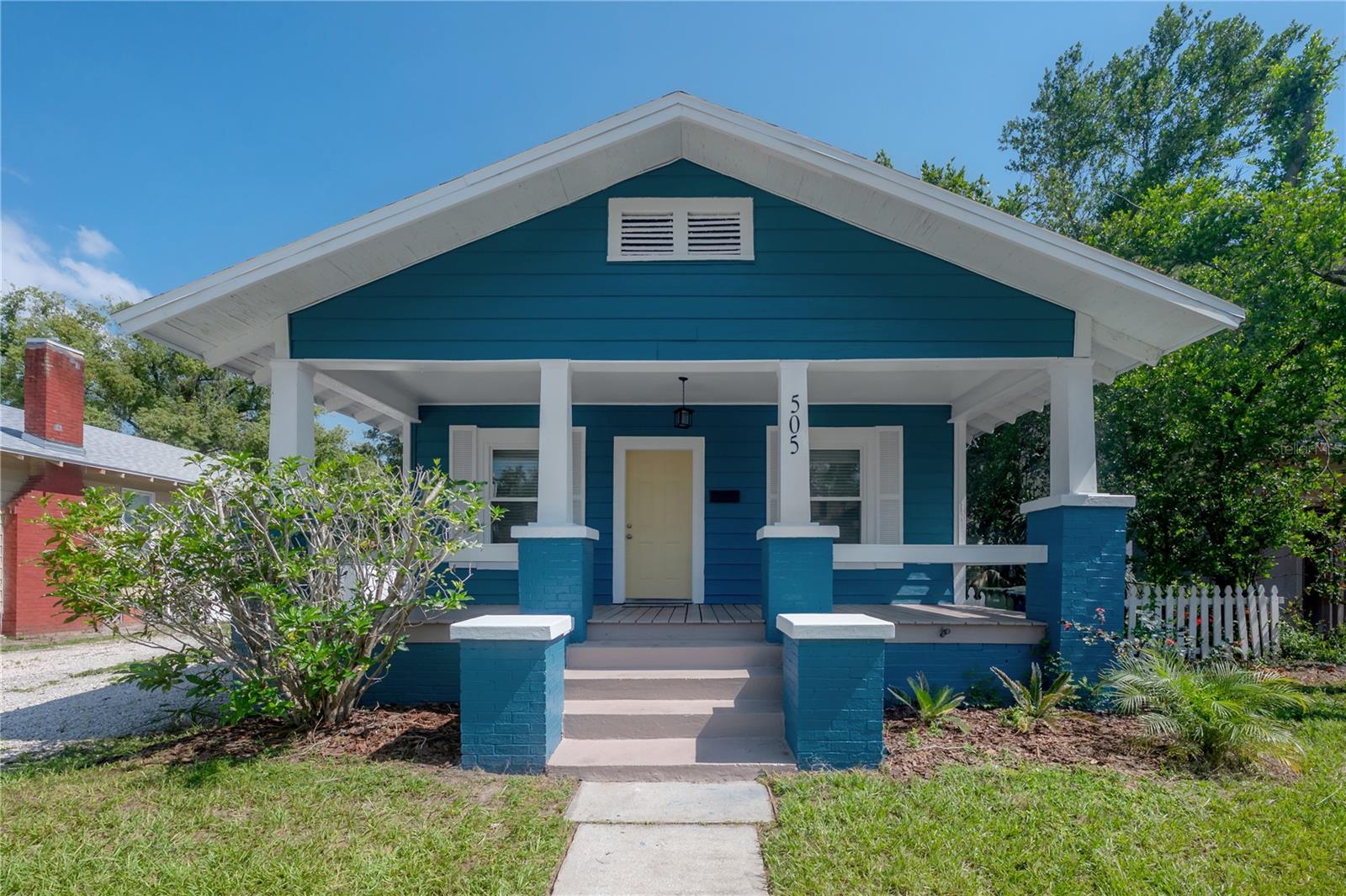 Come and see this pretty as a picture renovated 1920 bungalow in sought after Tampa Heights! This charmer is just an easy 1 mile bike ride away from the sparkling Riverwalk and all of its wonders. Step up onto the cool shade of the covered front porch and come inside to find a perfect open concept floorplan. The original brick fireplace makes for a cozy evening with some candles flickering their soft light. Head straight on through to the new kitchen featuring white shaker cabinets, breakfast bar with pendant lighting, granite counters and a cozy breakfast nook overlooking your spacious backyard with rear alley access. The guest bathroom has been tastefully updated with white subway tile in the walk in shower and basketweave tile flooring. The master bedroom has its own private bath with walk in shower, also with white subway tile. At your housewarming party, sit and relax on your new spacious deck with your friends while your famous brisket smokes slowly to mouth watering tenderness. You will love the updates: New hurricane impact windows, new front door, new roof 2018, new HVAC 2024 and fresh paint inside and out! This belle of the ball won't last long at only $495,000! Room sizes approx. BUILDERS: RM-16 ZONING.