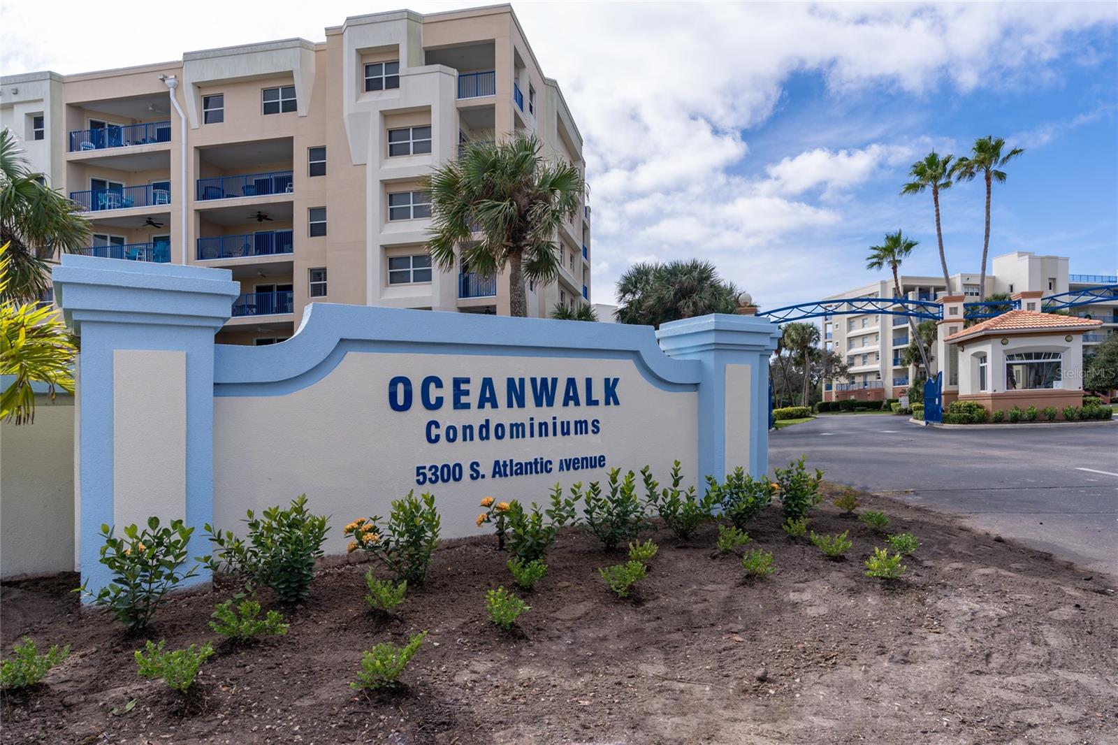 Welcome to your coastal sanctuary in the highly sought-after Ocean Walk community, ideally situated along the tranquil, no-drive stretch of New Smyrna Beach. This beautifully appointed 3-bedroom, 2-bath condominium is nestled on the 3rd floor of Building 10, offering expansive estuary views and abundant natural light as an end unit. Built in 2006 and thoughtfully updated, this fully furnished 1,771 sq ft residence blends refined comfort with modern conveniences. Recent enhancements include plush new carpeting and stylish living room furniture (2021), a sleek epoxy-coated balcony floor, recessed lighting, elegant plantation shutters, and newer kitchen appliances. The kitchen is a culinary delight with gleaming granite countertops, perfect for both entertaining and everyday living. A new A/C system was installed in 2017, ensuring year-round comfort. Step inside and feel instantly at home in the generously proportioned living space. The serene primary suite features a large walk-in closet and a luxurious ensuite bath complete with dual vanities, a spa-style Jacuzzi tub, and a separate walk-in shower. Two private balconies provide the ideal setting for morning coffee or evening relaxation, with the soothing sounds of the ocean just moments away. Additional conveniences include in-unit laundry, a trash chute on the same floor, secure garage parking, and a spacious private storage unit. Ocean Walk is a gated community offering an array of resort-style amenities: two sparkling pools, tennis courts, gas grills, shuffleboard, a private movie theater, two well-equipped fitness centers, jacuzzis, and dual clubhouses. A private beach walkover ensures effortless access to the pristine sands of New Smyrna’s exclusive no-drive beach. Building 10 has recently undergone significant exterior renovations, including full restoration and sealing of facades, application of three-coat 10-year warranty paint, new exterior lighting throughout, and balcony resurfacing—ensuring both beauty and longevity. Whether you seek a full-time residence, a seasonal retreat, or an income-producing vacation rental, this exceptional condo offers the ultimate blend of luxury, location, and lifestyle. Opportunities like this are rare—schedule your private showing today and discover coastal living at its finest.
