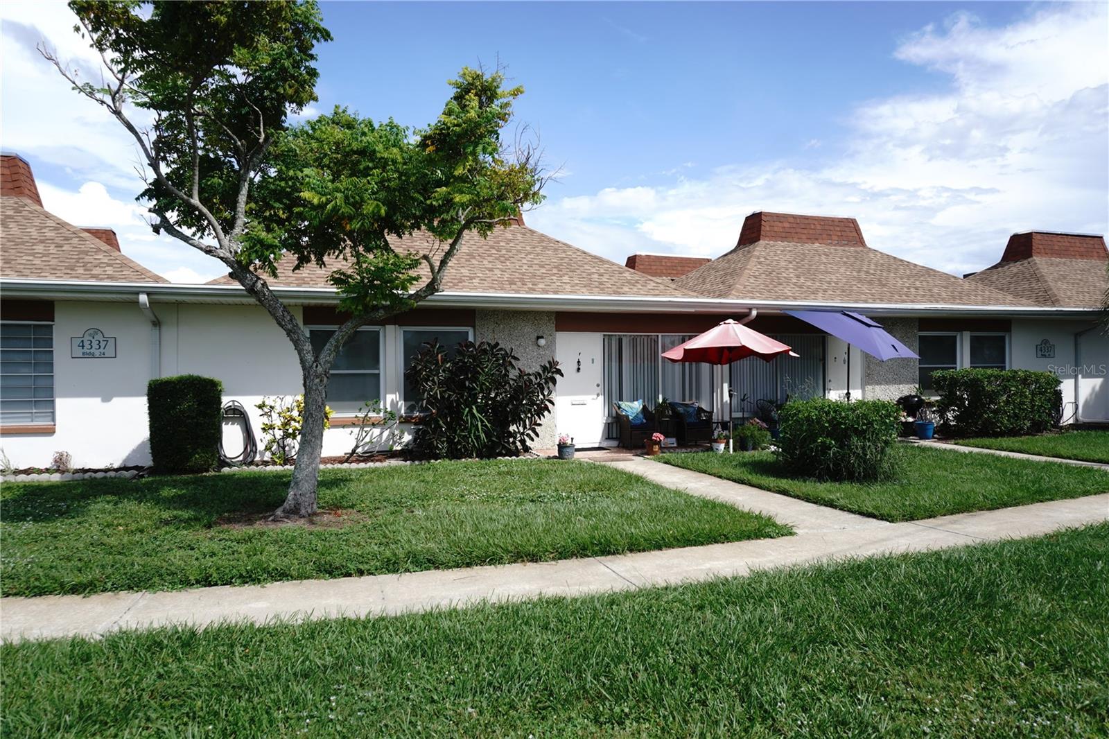 TURNKEY! Come see this stylishly updated, fully furnished, 2-bedroom, condo in the gated 55+ community of Tahitian Gardens. This exceptionally clean unit features granite counters, plentiful kitchen cabinets, dishwasher and an open floor plan. The master bedroom and living room have flat screen televisions. Ceiling fans in all rooms with both bedrooms having thermal windows for energy efficiency. For cleaner air a "Honeywell Elite Allergen Air Filter" is also installed. A large capacity washer/dryer unit is included for your convenience. Tahitian Gardens is a very active community with daily activities, play shuffleboard, watch the wildlife as you walk around the scenic lake or just relax in the large, heated swimming pool. Easy access to shopping and public transportation. Walking distance to CVS, Walgreens and Aldi's. Tampa and Clearwater International airports are less than an hour’s drive. Minutes away from Tarpon Springs, the Sponge Docks and the beach at Howard Park. No pets and non-smokers only. Easy to see, shown by appointment. NOTE: This unit may be available as a 6-month seasonal rental at a higher rate.