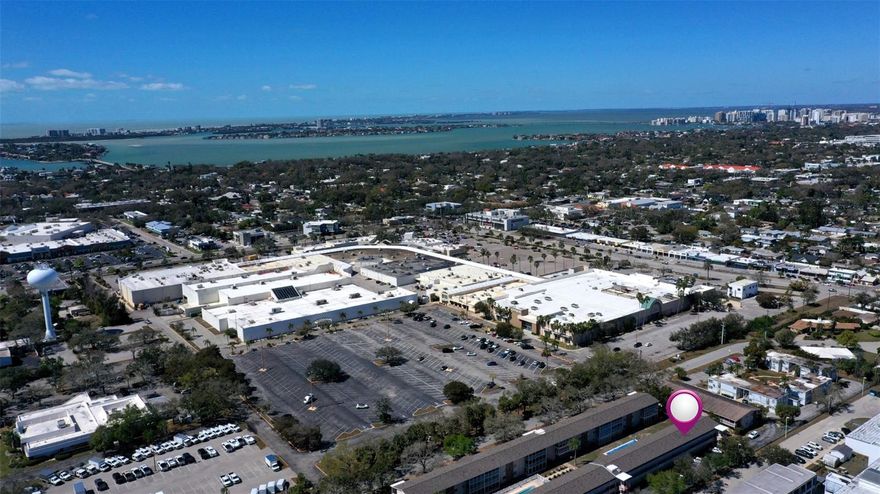 Stunning and move-in ready, this beautifully renovated and fully furnished 2-bedroom, 2-bath condo offers effortless living in an exceptionally convenient central Sarasota location. Perfectly positioned in the heart of the city, you are just minutes from Downtown Sarasota, Sarasota Memorial Hospital, and a straight drive to Siesta Key’s world-famous beaches. Enjoy the rare combination of accessibility and everyday walkability, with popular dining, cafés, and entertainment only a short stroll away. Inside, the condo has been updated to the nines, showcasing a bright, naturally light interior and a complete 2023 renovation including a modern kitchen with quartz countertops and breakfast bar, fully renovated bathrooms, updated flooring throughout, impact (hurricane-rated) windows, and custom window treatments. Offered fully furnished and move-in ready, this residence is ideal for seasonal living, downsizing, or anyone seeking a low-maintenance Sarasota retreat. Ground-floor convenience, a quiet private setting, parking directly outside the unit, and the added benefit of not being located in a flood zone further enhance the appeal. The community pool and laundry facilities are just steps away, adding to the ease of everyday living. Located within a desirable 55+ community, this condo delivers comfort, simplicity, and exceptional lifestyle appeal. Spend your time enjoying Sarasota’s favorite attractions while living in the heart of the city — mornings on Siesta Key’s world-renowned beaches, afternoons exploring local markets and boutiques, and evenings spent dining at the area’s exceptional restaurants.