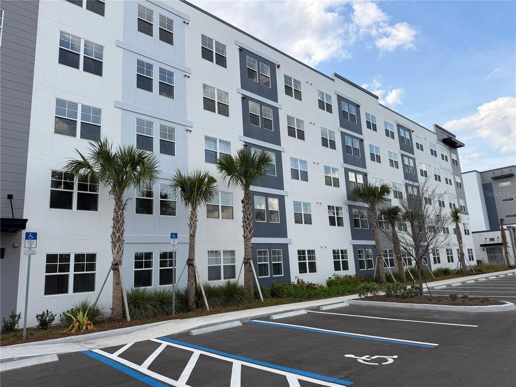 Photo of 5587 Millenia Park Boulevard #402, Orlando, FL 32839 (MLS # O6401782)