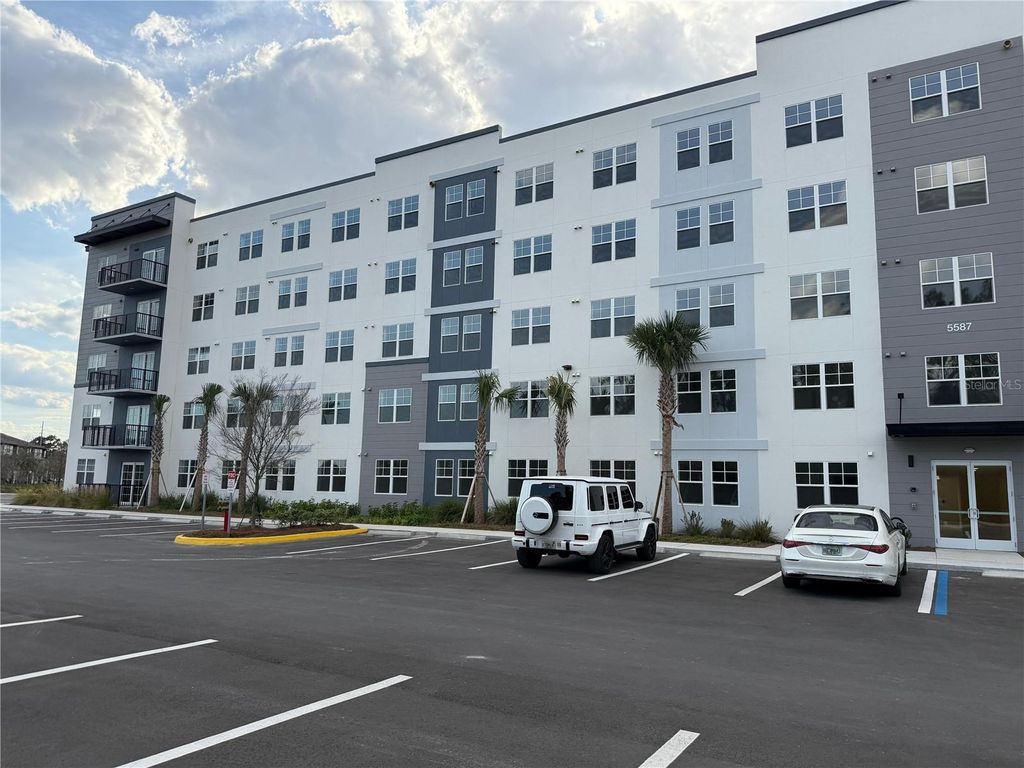 Photo of 5587 Millenia Park Boulevard #402, Orlando, FL 32839 (MLS # O6401782)