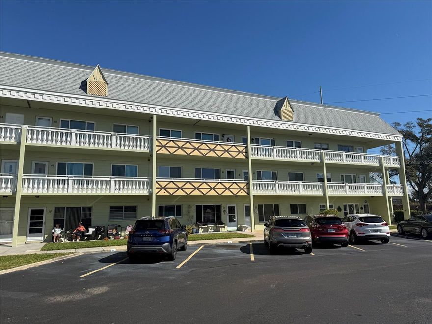 Beautiful, fully furnished, first-floor condo in the vibrant, active lifestyle community of On Top of the World. This two-bedroom, two-bath gem features wood-look laminate flooring throughout its living spaces and bedrooms. The kitchen boasts wood cabinets, under-mount lighting, matching appliances, and a spacious pantry nearby. Adjacent is a bright Florida room with a utility closet, housing a newer 2024 hot water heater and updated recessed lighting. Both bathrooms are beautifully remodeled, with a walk-in shower in the primary suite and a shower-tub combo in the guest bath. Enjoy energy efficiency with double-pane windows and the convenience of a stackable washer/dryer in the primary closet. The rear patio with epoxy floor, opens to a serene, private green space, and the brand new 2025 AC unit was repositioned to provide more space for entertaining guests or relaxing on a beautiful sunny day! Located on a quiet cul-de-sac, you’re just moments from the community clubhouse and all the incredible amenities—heated pools, private golf, tennis, a state-of-the-art gym, and more. Don’t miss this exceptional opportunity!