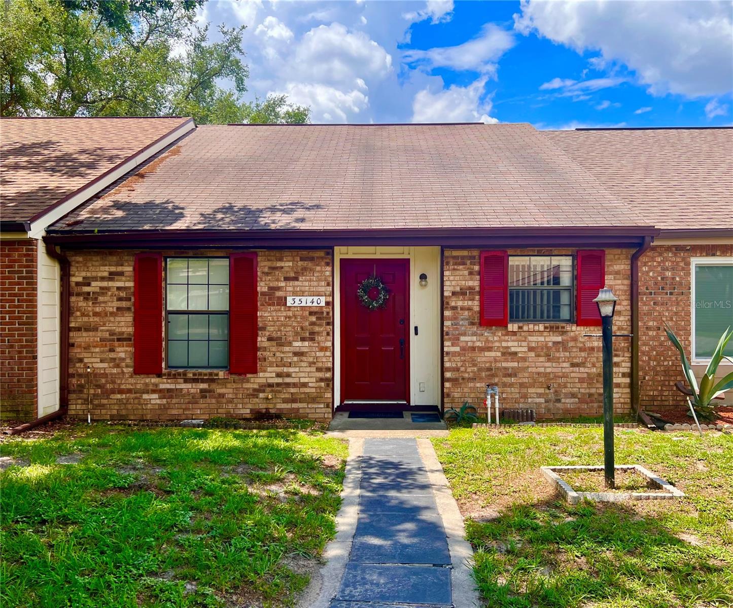 Low Maintenance living in well established Whispering Oaks community! Conveinently located near U.S. Hwy 301 and S.R. 50 and only minutes from I75, beautiful cozy 2 Bedroom 2 Bath villa with vaulted ceilings, adjoins the HOA villa used for meetings and social activities. Spacious living/dining room area, Master bedroom has private master bathroom walk-in closet and seperate entrance to the florida room. Florida room also boasts original cedar wood siding giving it a natural cozy cabin feel. Also has large open air patio out back. Home is mostly all original, but has been extremely well kept. Sprinkler system installed. Move in ready as-is or update to your own taste. Attic ladder access with some storage. Additional storage in the laundry room and has room to park a golf cart. Golf course currently closed and for sale. Home comes with one covered parking space and one uncovered parking space. Call for a showing today!