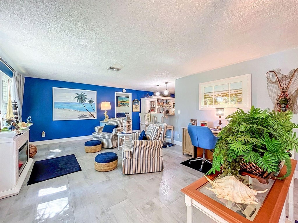 Photo of 990 Lexington Dr, Dunedin, FL 34698 (MLS # TB8552536)