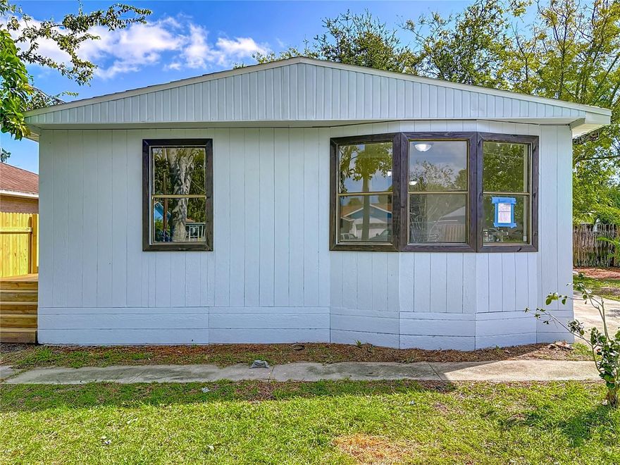 This Home has a New Roof, New Soffits, New Flooring, Exterior Completely Painted, New Kitchen, Completely Remodeled 2 Bathroom and a large shed for storage. The central AC has been updated also. All the appliances are included including the washer and dryer. This manufactured home is not in a manufactured home area. It is in the very desirable Holly Hill Heights area with single family homes. This home is a great buy at this price!