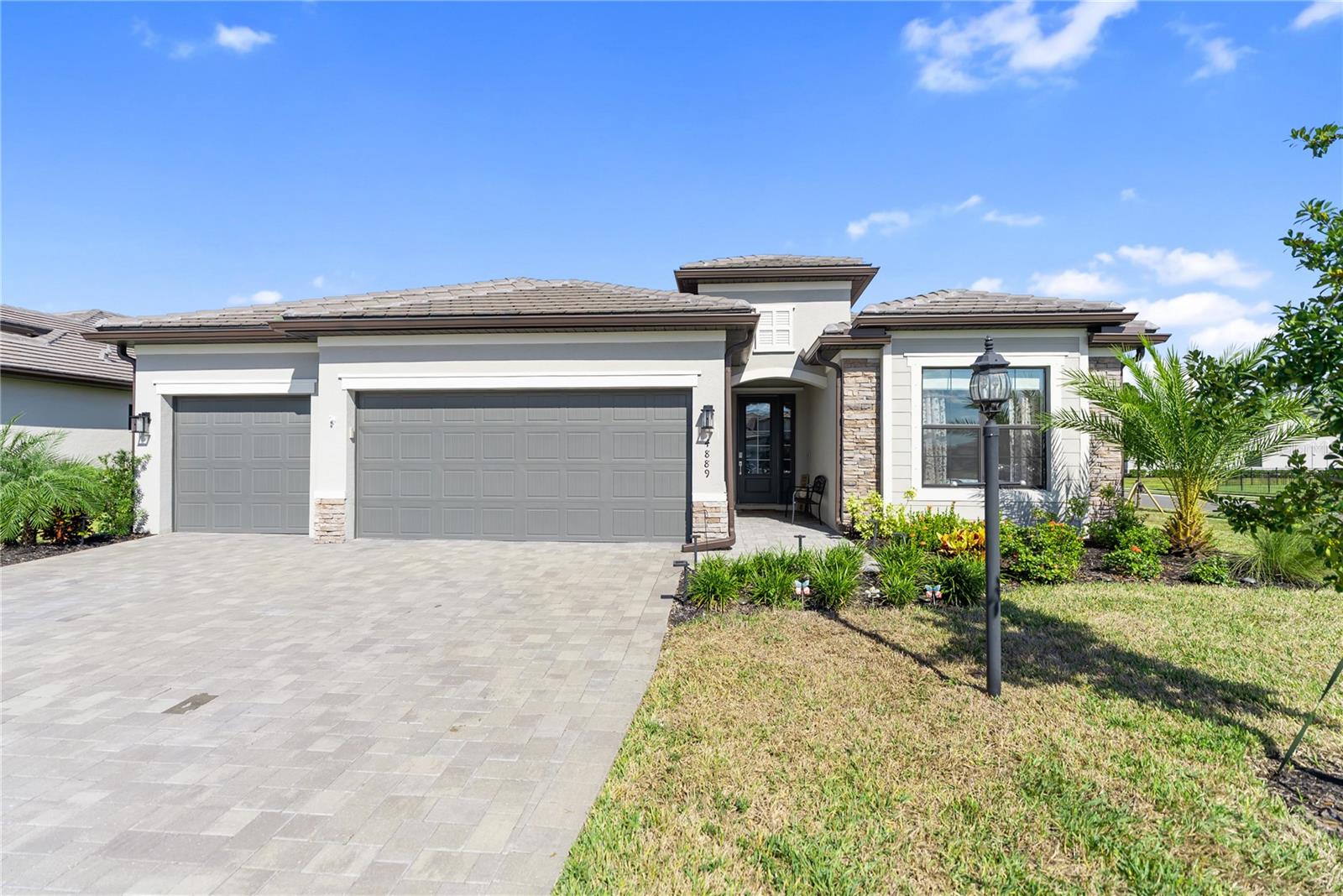 Welcome home!
No need to look further: 4889 Seafoam Trail is where comfort, care, and community come together in one of Lakewood Ranch’s most desirable resort-style neighborhoods - Lorraine Lakes.
Perfectly positioned on a premium corner lot, this beautiful home radiates pride of ownership. Every inch has been exceptionally maintained, offering true peace of mind and a sense of “new home” freshness that’s hard to find.
Inside, the thoughtfully designed split floor plan flows seamlessly, blending open-concept living with defined spaces for gathering, working, or simply relaxing.
This home offers a generous floor plan with high ceilings and an open layout, giving everyone a comfortable sense of space and privacy. The main living area flows easily between the kitchen, dining, and great room, perfect for everyday living or hosting family and friends.
The primary suite sits privately at the back of the home and includes a tray ceiling, walk-in closet, and spacious bath with dual sinks and a large glass-enclosed shower. Three additional bedrooms are thoughtfully positioned to give everyone their own space to unwind.
The 3-car garage offers flexibility for vehicles, storage, or a workshop, giving you the extra space you didn't know you needed.
You are an only a quick golf cart ride away from the resort-style amenities of Lorraine Lakes, where every day feels like a mini vacation. Enjoy multiple pools, a restaurant with an indoor and outdoor bar, a coffee station, a fitness center, tennis and pickleball courts, endless social activities, and scenic walking trails, all surrounded by the natural beauty and connection that define the Lakewood Ranch lifestyle.
Whether you’re a year-round resident or seeking a seasonal retreat, this home delivers an easy, active, and beautifully maintained Florida lifestyle. Don't wait, schedule your private tour today and let's make this your next chapter!