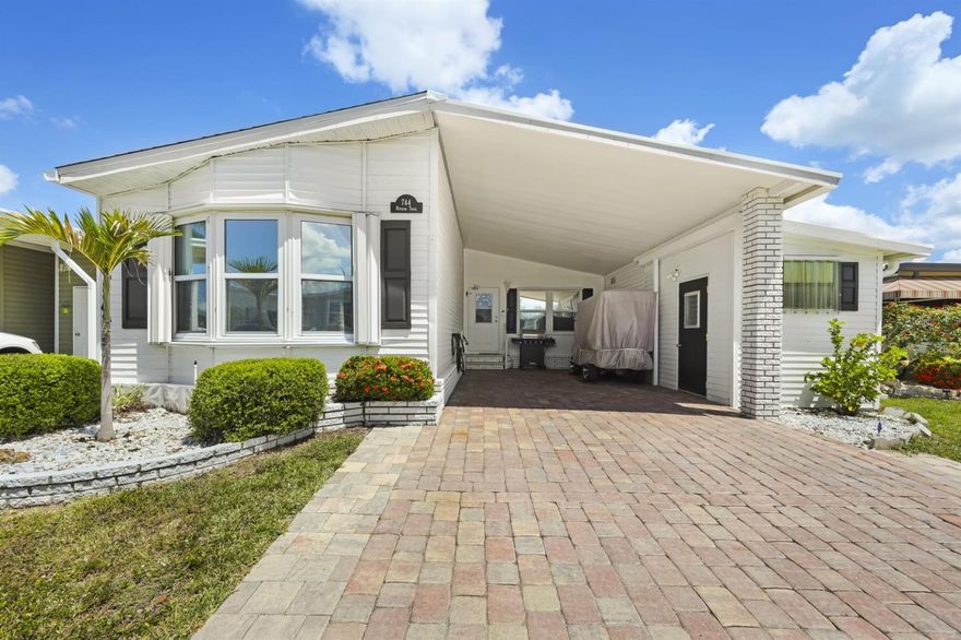 Ohhh we’re turning the charm all the way up!  Welcome to your “why didn’t I move here sooner?” moment in sunny Port Charlotte!  This 1987 cutie brings 1,167 square feet of easy living with 2 bedrooms, 2 baths, and a split floor plan—because yes, you can enjoy your guests… and still have your own space when you’ve had enough.  Step inside and you’ll find LIFEPROOF 7mm LUXURY PLANK FLOORING that says, “I’ve got style and I’m low maintenance,” just like the lifestyle you’re about to live. SHINGLE ROOF with rubber membrane roof underlay, MEMBRANE ROOFOVER ON LANAI,  (2023), new wood trim base and crown molding, new interior and exterior paint… because adulting is way more fun when the big stuff is already done.  New front door and closer, new kitchen cabinets, new countertops, new painted island and dining cabinets, new refrigerator, stove, microwave, dishwasher, new tile backsplash and more.  Outside? You’ve got a brick paver driveway bringing the curb appeal, plus TWO sheds—one for your tools, one for your “I might use this someday” collection.  And then there’s the lanai… aka your new favorite spot. Morning coffee? ??  Evening beverage? ??  Relaxing?  All of this tucked inside a 55+ gated golfing community where your biggest daily decision might just be:  “Pool, golf, or pickleball first?” ???  Whether you’re snowbirding or going full-time Florida mode, this home is ready to make your friends just a little jealous.  SOLD PARTIALLY FURNISHED.  This home is located in the award winning gated, 55+ golfing community of Maple Leaf Golf & Country Club.  This park features a vital, energetic resort lifestyle where there is more to do than hours in the day. With 4 pickleball courts, 5 tennis courts, bocce ball, 4 heated swimming pools, 2 shuffleboard court centers, lawn bowling, mini golf, 2 hot tubs, 2 restaurants, fitness center, golf course, over 75 clubs and activities, if you're bored it's your own fault! There's no better place to begin your next chapter.