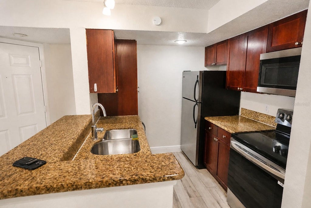 Photo of 5156 Conroy Road #16, Orlando, FL 32811 (MLS # O6433879)