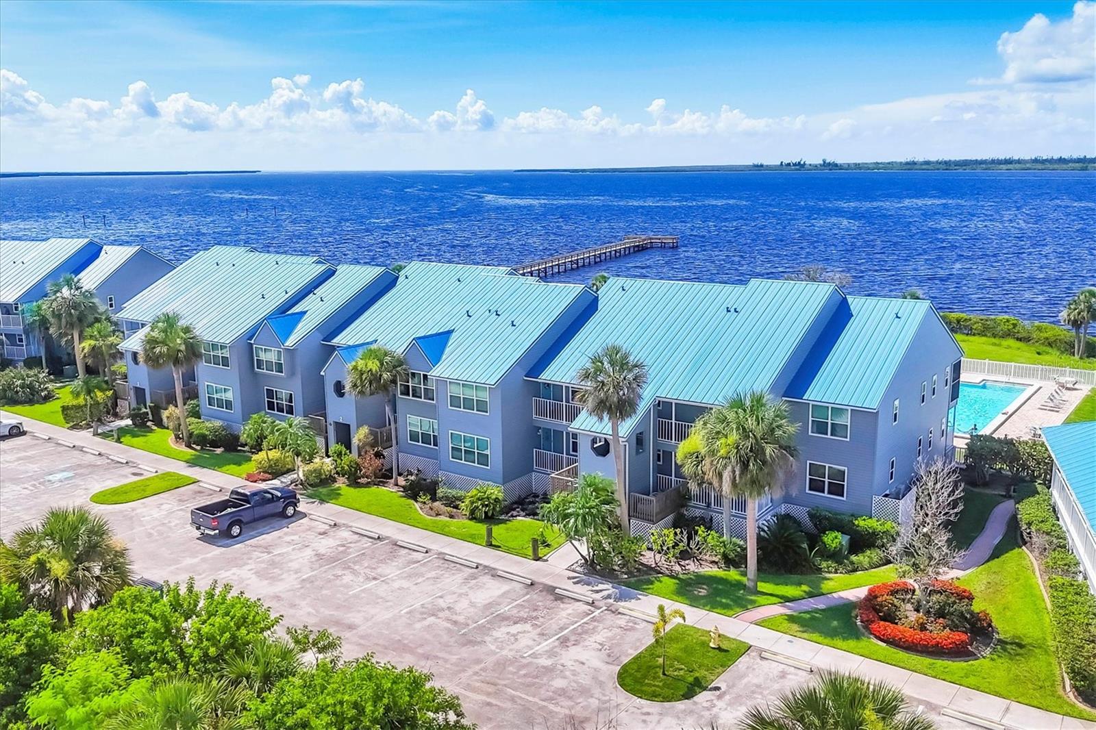 Experience captivating waterfront views from this welcoming first floor condo in Harbour Village—a serene coastal haven designed for effortless living. Cast your line from the private fishing pier, dock your boat at the first-come, first-serve slip, or unwind beside the Olympic-size pool. This low-maintenance residence offers remarkable flexibility as a year-round home or as a seasonal retreat. With an unbeatable price point and prime proximity to the stunning beaches of Manasota Key and Boca Grande, exceptional dining, shopping, and access to multiple airports, this is your gateway to everything Southwest Florida provides.