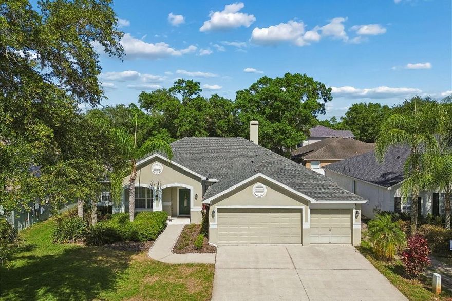 BEAUTIFULLY UPDATED POOL HOME with NEW ROOF (2025), AC (2021), RENOVATED KITCHEN & BATHS, NEW FLOORING, AND A+ SCHOOLS! Welcome to this beautifully maintained David Weekley pool home located in a quiet and highly desirable community. Thoughtfully designed with 4 bedrooms, 3 full baths, a 3-car garage, and a versatile bonus room, this home offers an open and functional layout ideal for both everyday living and entertaining. Engineered HARDWOOD floors flow throughout the main living areas and primary suite. The renovated kitchen serves as the heart of the home, featuring stylish two-tone cabinetry, quartz countertops, and an oversized 4’ x 9’ island that creates the perfect space for entertaining and everyday living. The front living room offers flexible space for a sitting area and can easily be enclosed to create a private office, while the expansive family room provides a comfortable setting for relaxing and gathering with guests. The primary suite features a cozy sitting area, a luxurious en-suite bath, and a large walk-in closet. A split-bedroom floor plan provides added privacy, including Jack-and-Jill bedrooms and a fourth bedroom with direct access to its own bath, which also serves conveniently as a pool bath. New carpet has recently been installed in all guest bedrooms. The flexible bonus room is ideal as a playroom, media room, home office, or potential 5th bedroom. Step outside to your private backyard retreat featuring a sparkling pool and shaded seating areas perfect for year-round enjoyment. Conveniently located near Citrus Park Mall, the Veterans Expressway, and Tampa International Airport, and featuring a low HOA of just $62/month, this move-in ready home offers the perfect blend of comfort, style, and convenience. With thoughtful upgrades and flexible living spaces, this home is ready to impress.